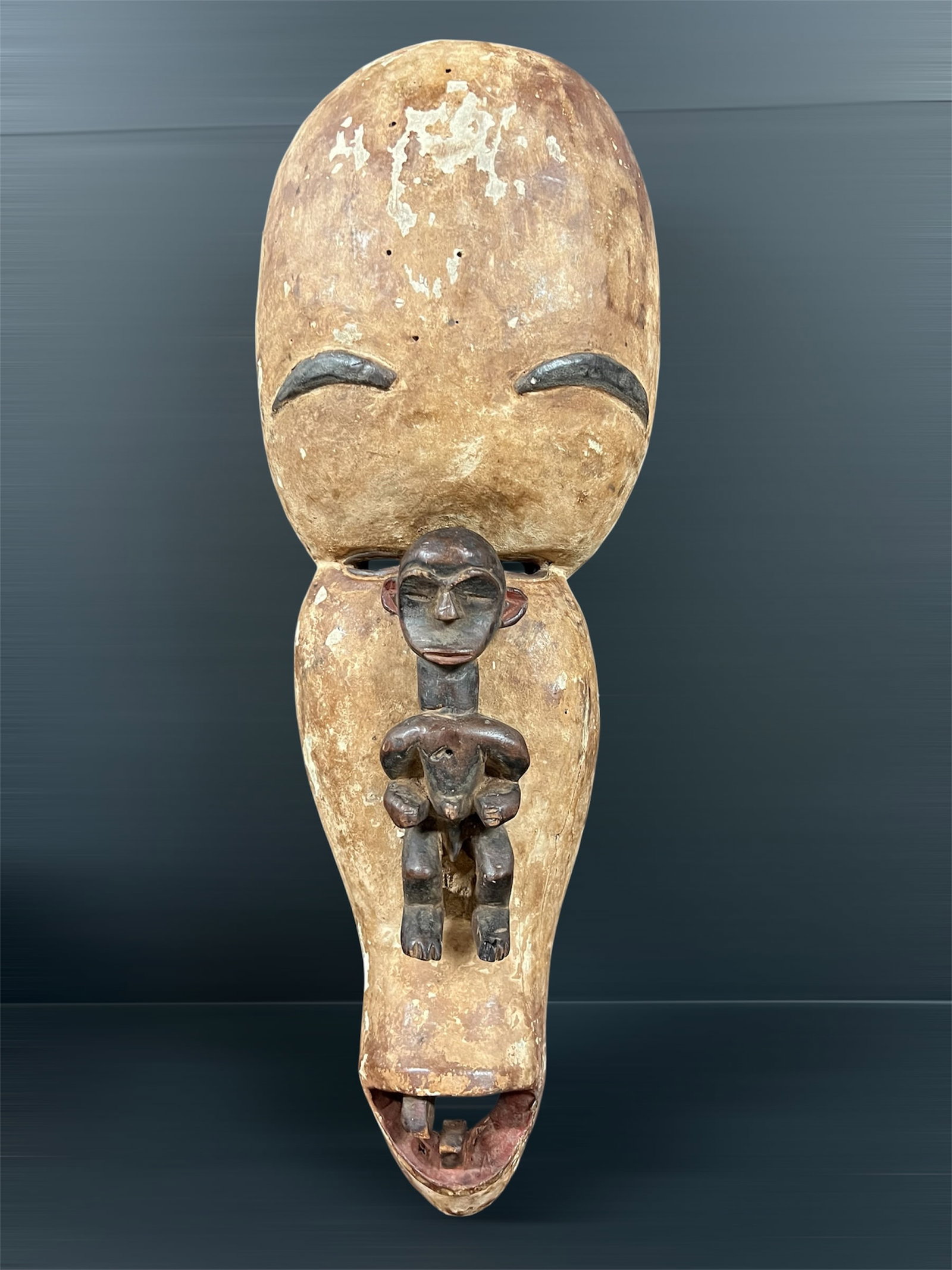 Large Fang Mask: African Tribal Art Large Fang Mask. The dimension is 25 inches high x 9 inches wide. Please be aware that some of the items are vintage, secondhand, old ages, antiques and may have a defects or sign