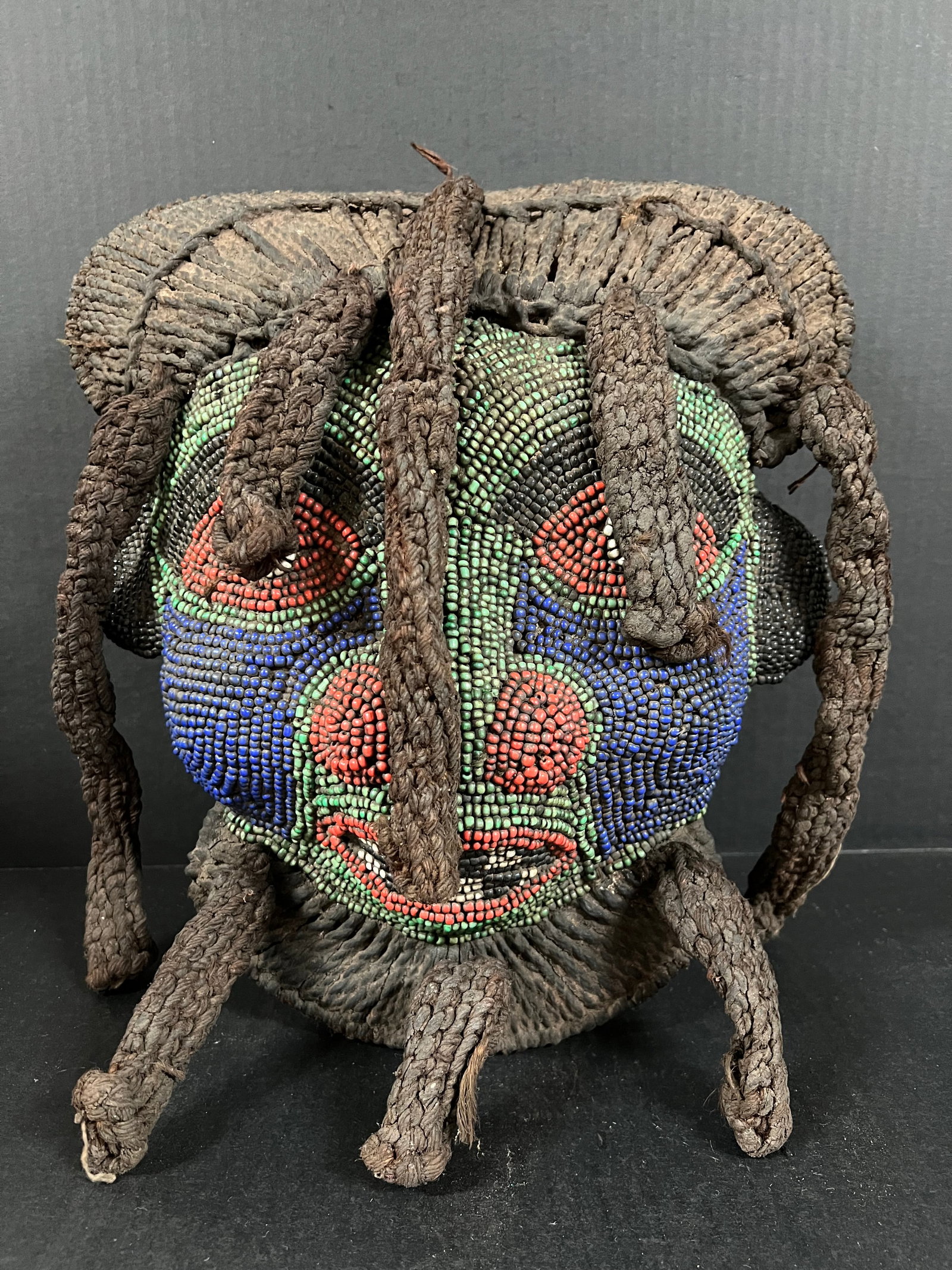 Bamileke Beaded Mask: African Tribal Art Bamileke Beaded Mask. The dimension is 15 inches high x 13 inches wide. Please be aware that some of the items are vintage, secondhand, old ages, antiques and may have a defects or