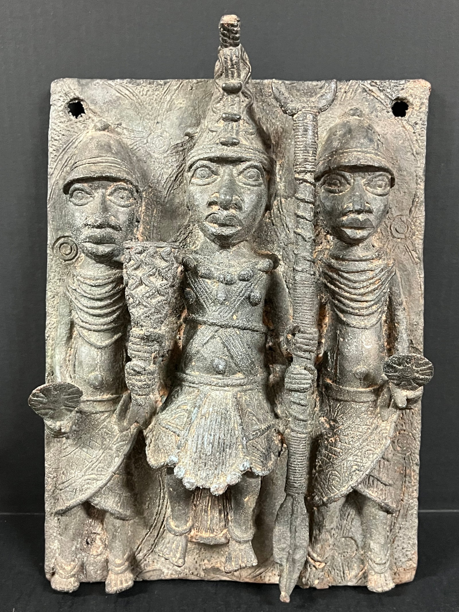 Benin Bronze Plaque: African Tribal Art Benin Bronze Plaque. The dimension is 16.5 inches high x 11.25 inches wide. Please be aware that some of the items are vintage, secondhand, old ages, antiques and may have a