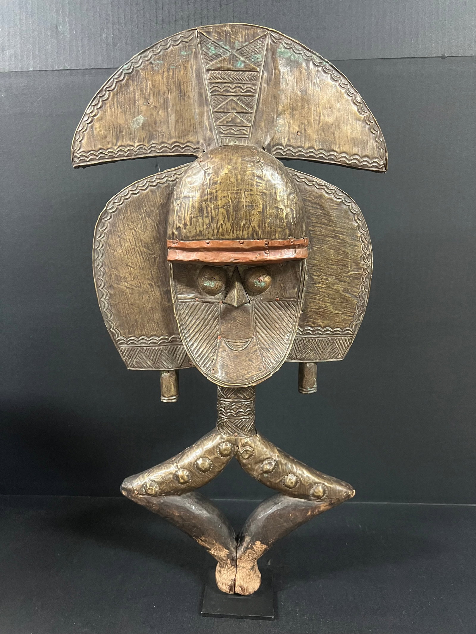 Bacota Reliquary Guardian: African Tribal Art Bacota Reliquary Guardian. The dimension is 23.5 inches high x 12.5 inches wide. Please be aware that some of the items are vintage, secondhand, old ages, antiques and may have a