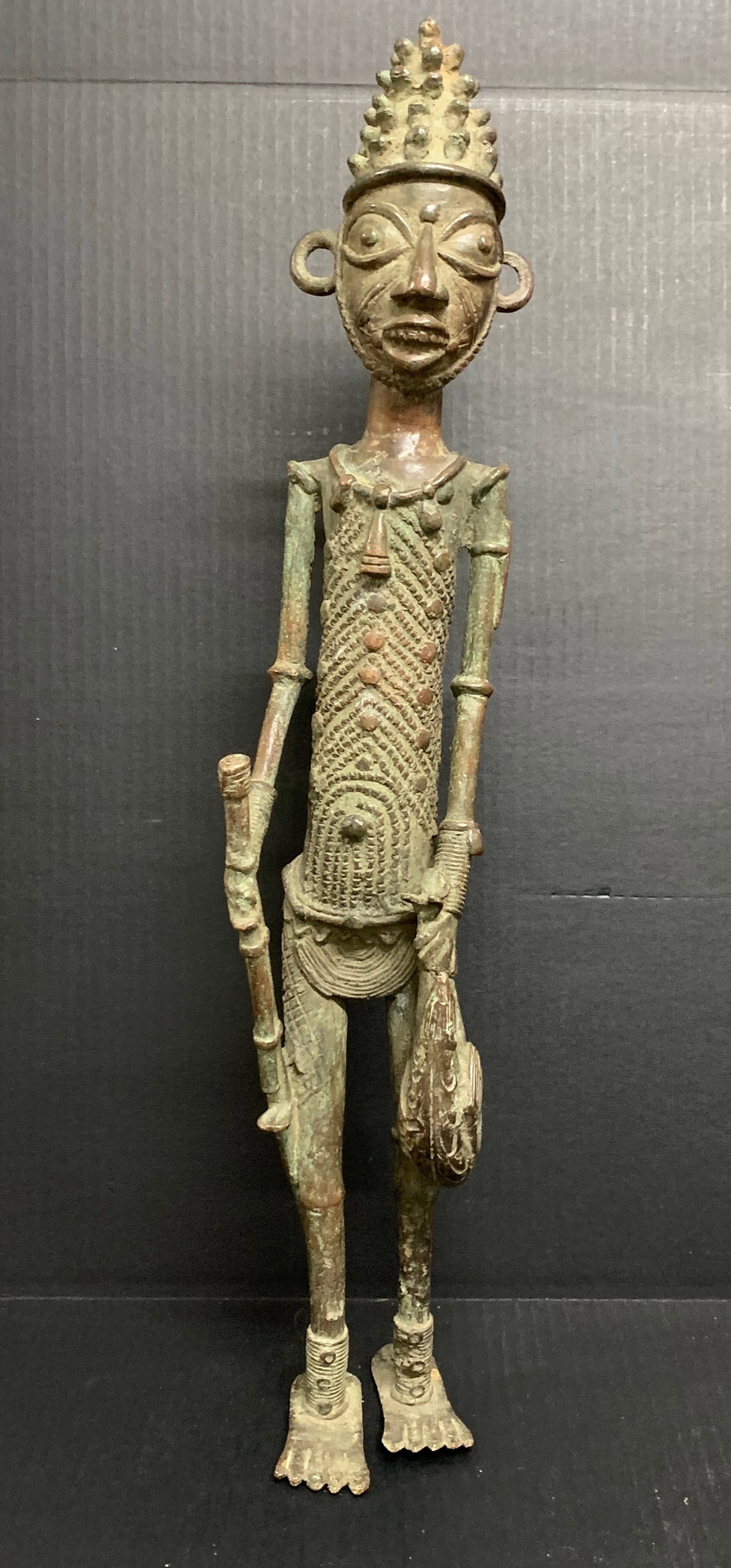Dogon Bronze Statue: African Tribal Art Dogon Statue. The dimension is 24 inches high x 4 inches wide. Please be aware that some of the items are vintage, secondhand, old ages, antiques and may have a defects or sign of a