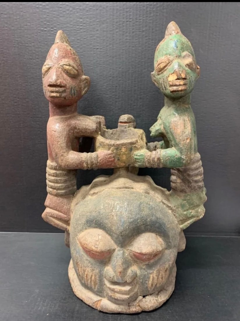 Carved Wood Yuroba Helmet Mask: African Tribal Art Carved Wood Yuroba Mask. The dimension is 21 inches high x 13 inches wide. Please be aware that some of the items are vintage, secondhand, old ages, antiques and may have a defects