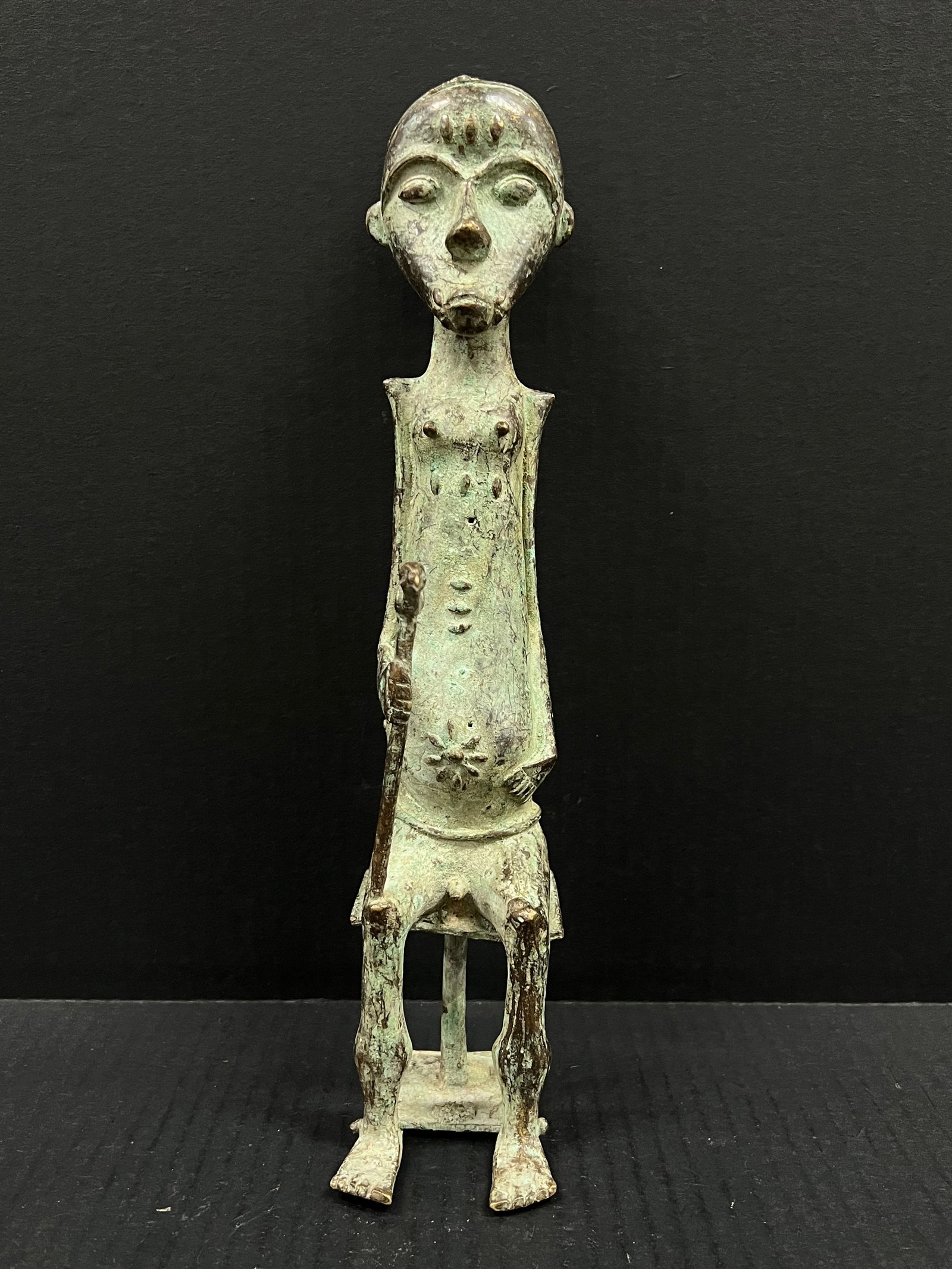 Bronze Baule Statue: African Tribal Art Bronze Baule Statue. The dimension is 12.75 inches high x 3 inches wide. Please be aware that some of the items are vintage, secondhand, old ages, antiques and may have a defects
