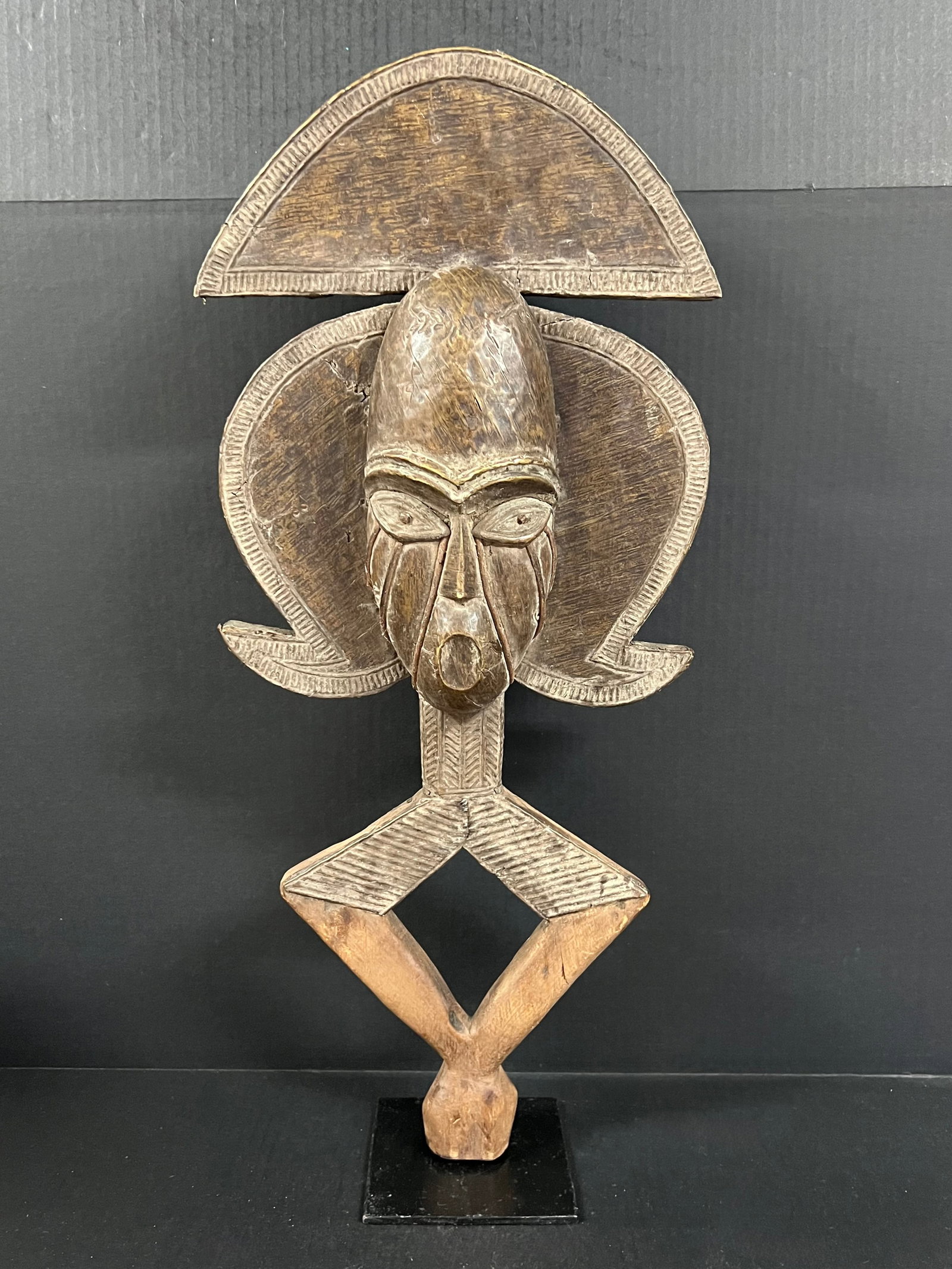 Bacota Reliquary Guardian Statue: African Tribal Art Bacota Reliquary Guardian Statue. The dimension is 26 inches high x 11 inches wide. Please be aware that some of the items are vintage, secondhand, old ages, antiques and may have