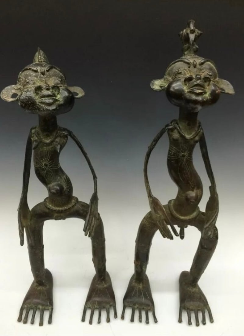 Bronze Pair of Mambila Statue: African Tribal Art Bronze Pair of Mambila Statue. The dimension is 18 inches high x 7 inches wide and 19.5 inches high x 6.75 inches wide. Please be aware that some of the items are vintage, secondhan