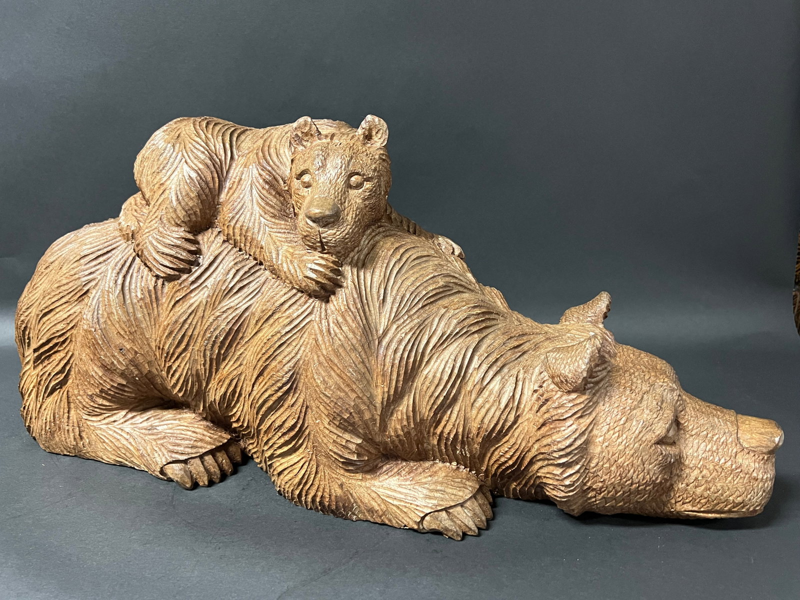 Hand Carved Wooden Large Bear and Cub Sculpture: Folk Art Hand Carved Wood Large Bear and A Cub Sculpture. The dimension is 10 inches high x 24 inches wide. Please be aware that some of the items are vintage, secondhand, old ages, antiques and may h