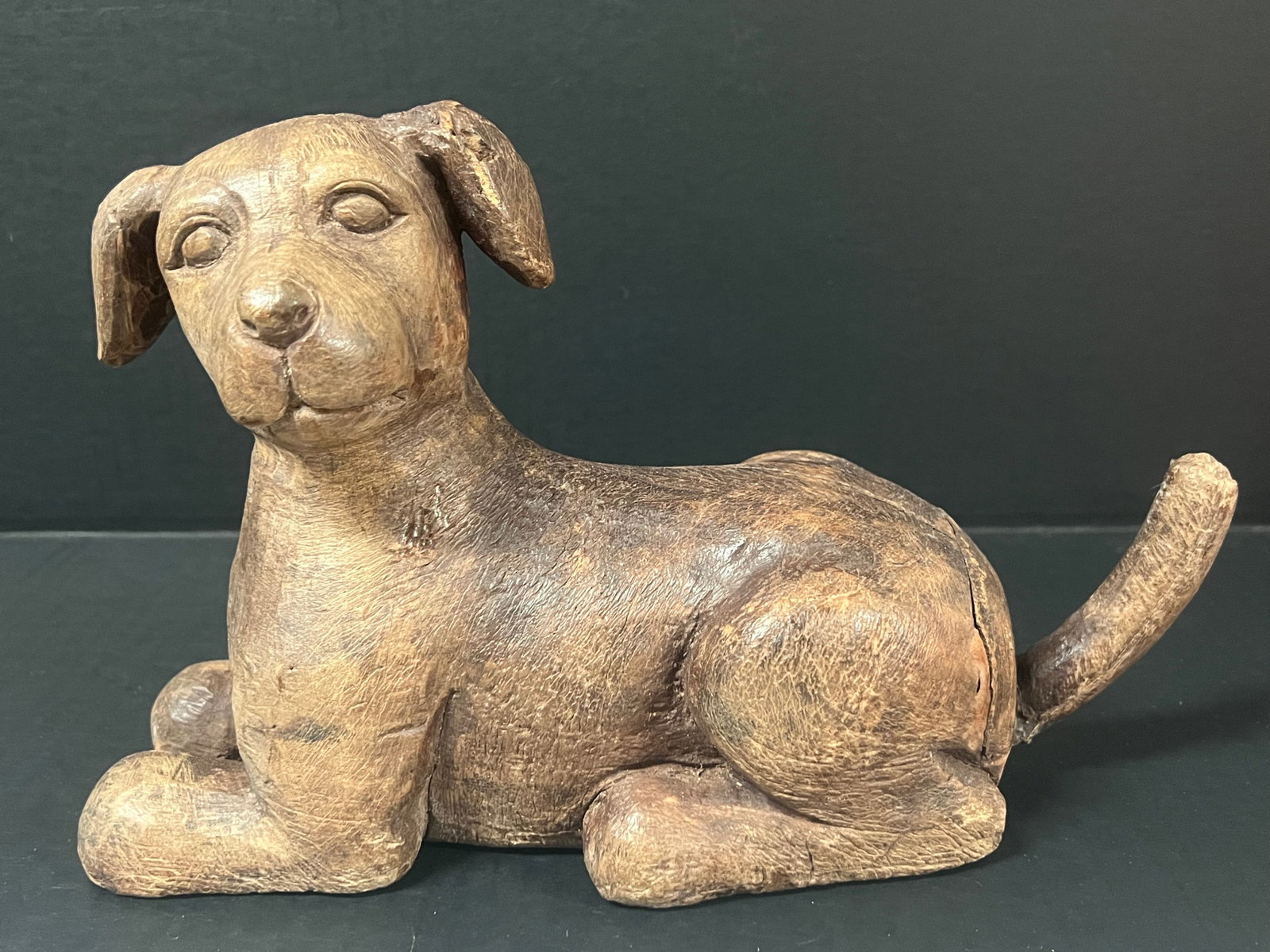 Hand Carved Wooden Dog Sculpture: Folk Art Hand Carved Wood Dog Sculpture. The dimension is 7.5 inches high x 12.5 inches wide. Please be aware that some of the items are vintage, secondhand, old ages, antiques and may have a defects 