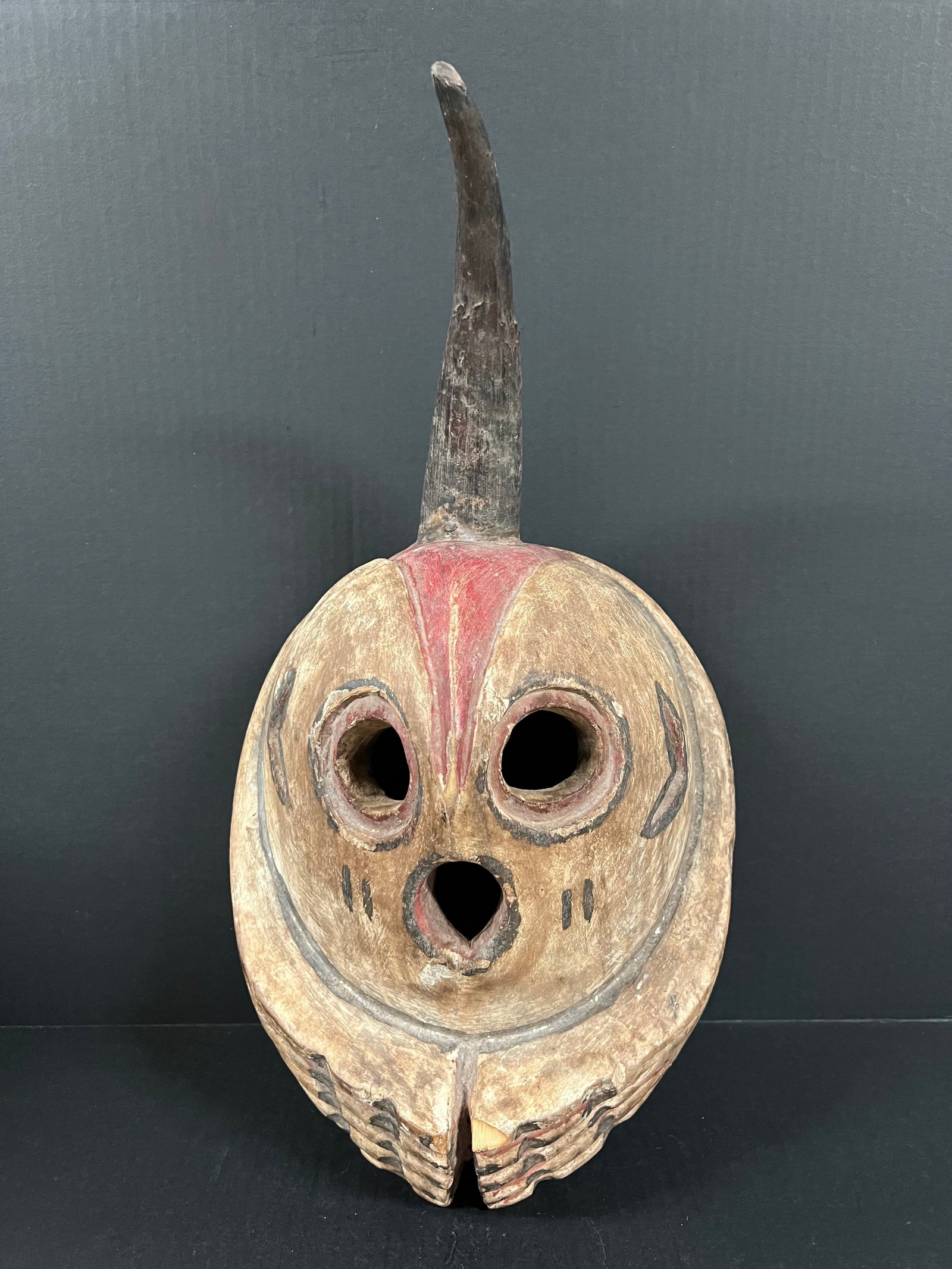Skull Mask: African Tribal Art Skull Mask. The dimension is 19 inches high x 11 inches wide. Please be aware that some of the items are vintage, secondhand, old ages, antiques and may have a defects or sign of