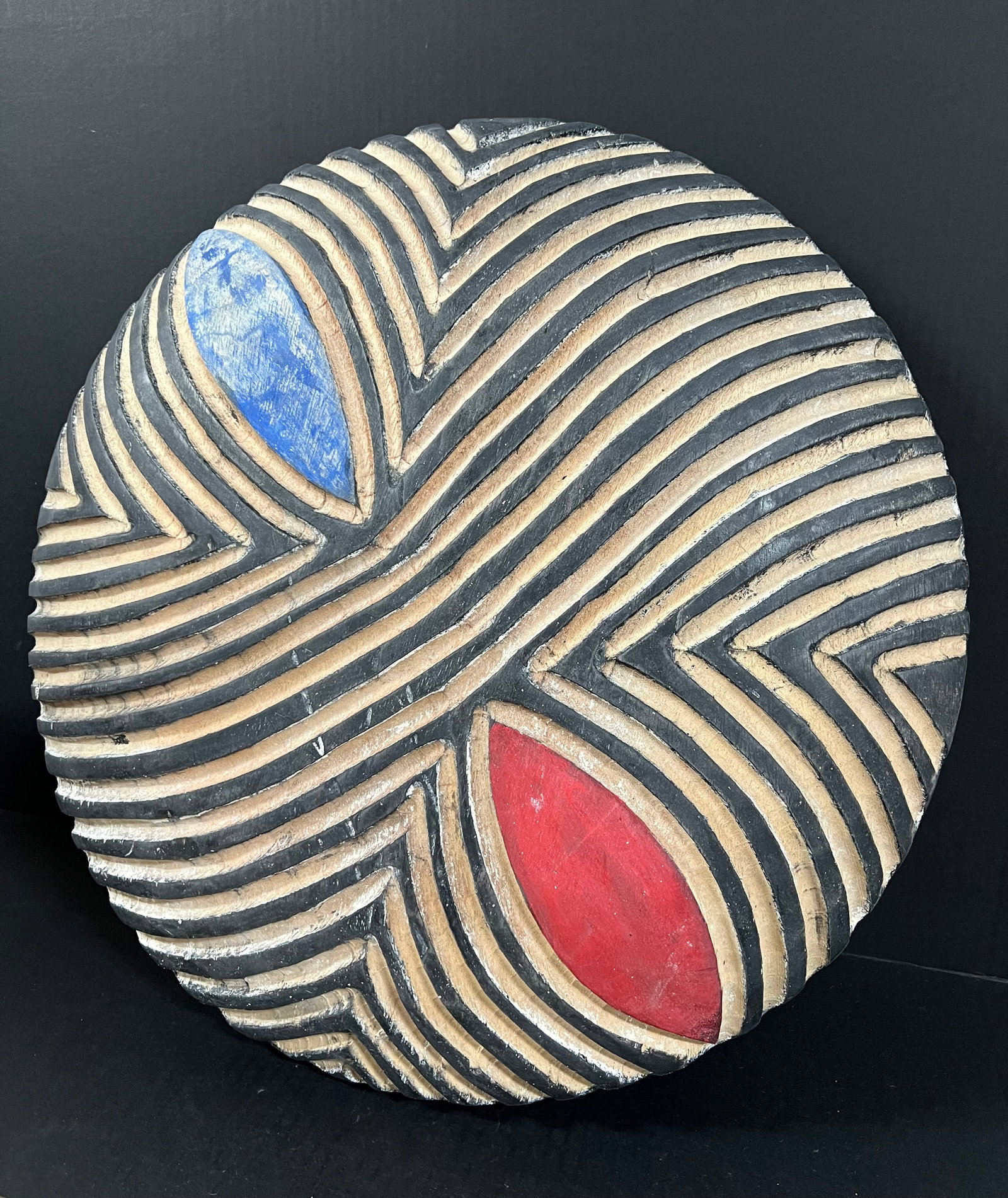 Zulu Shield: African Tribal Art Zulu Shield. The dimension is 20.5 inches high x 20.5 inches wide. Please be aware that some of the items are vintage, secondhand, old ages, antiques and may have a defects or sign