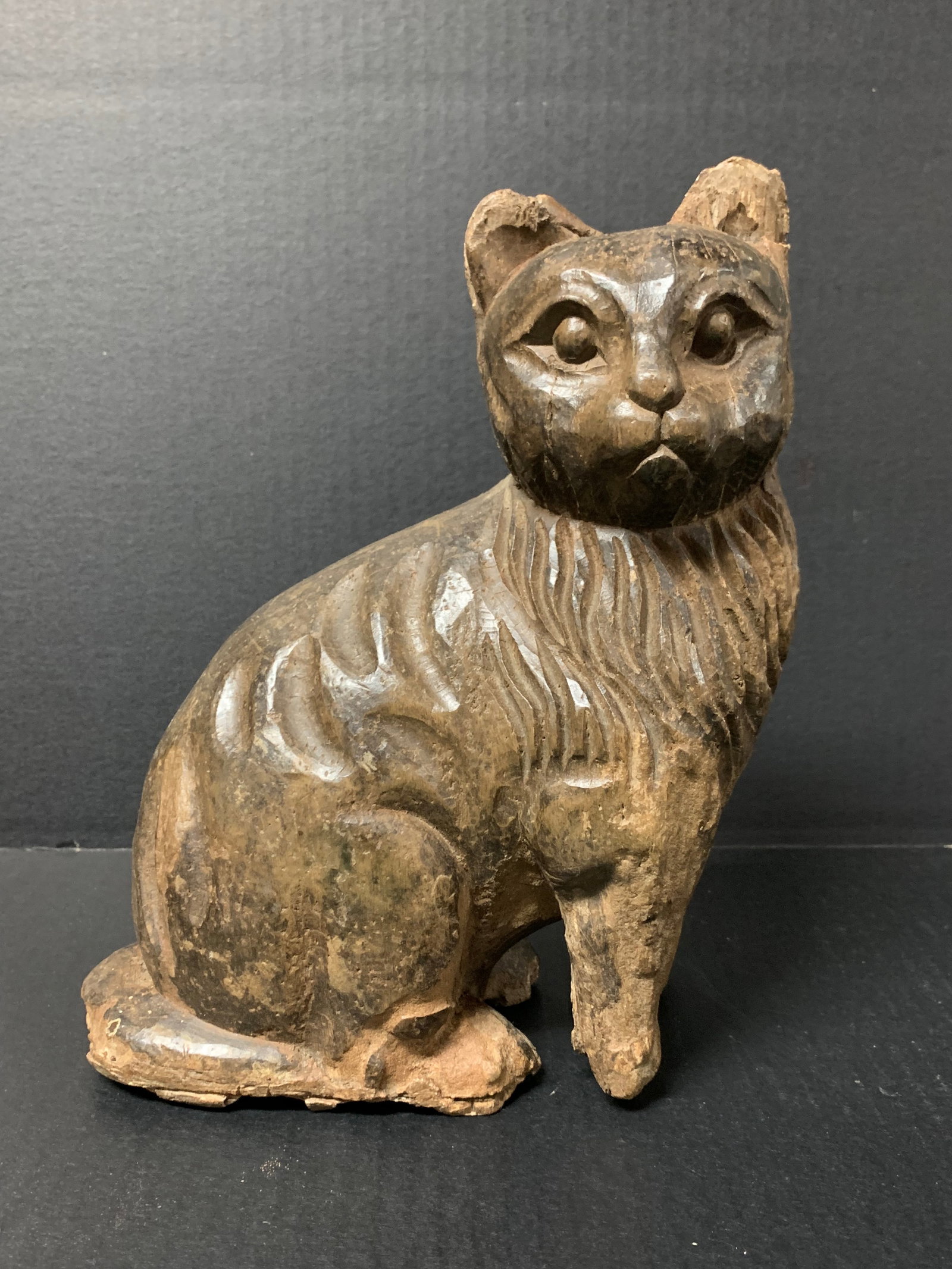 Hand Carved Wooden Cat Sculpture: Folk Art Hand Carved Wooden Cat Sculpture. The dimension is 10.5 inches high x 8 inches wide. Please be aware that some of the items are vintage, secondhand, old ages, antiques and may have a defects 