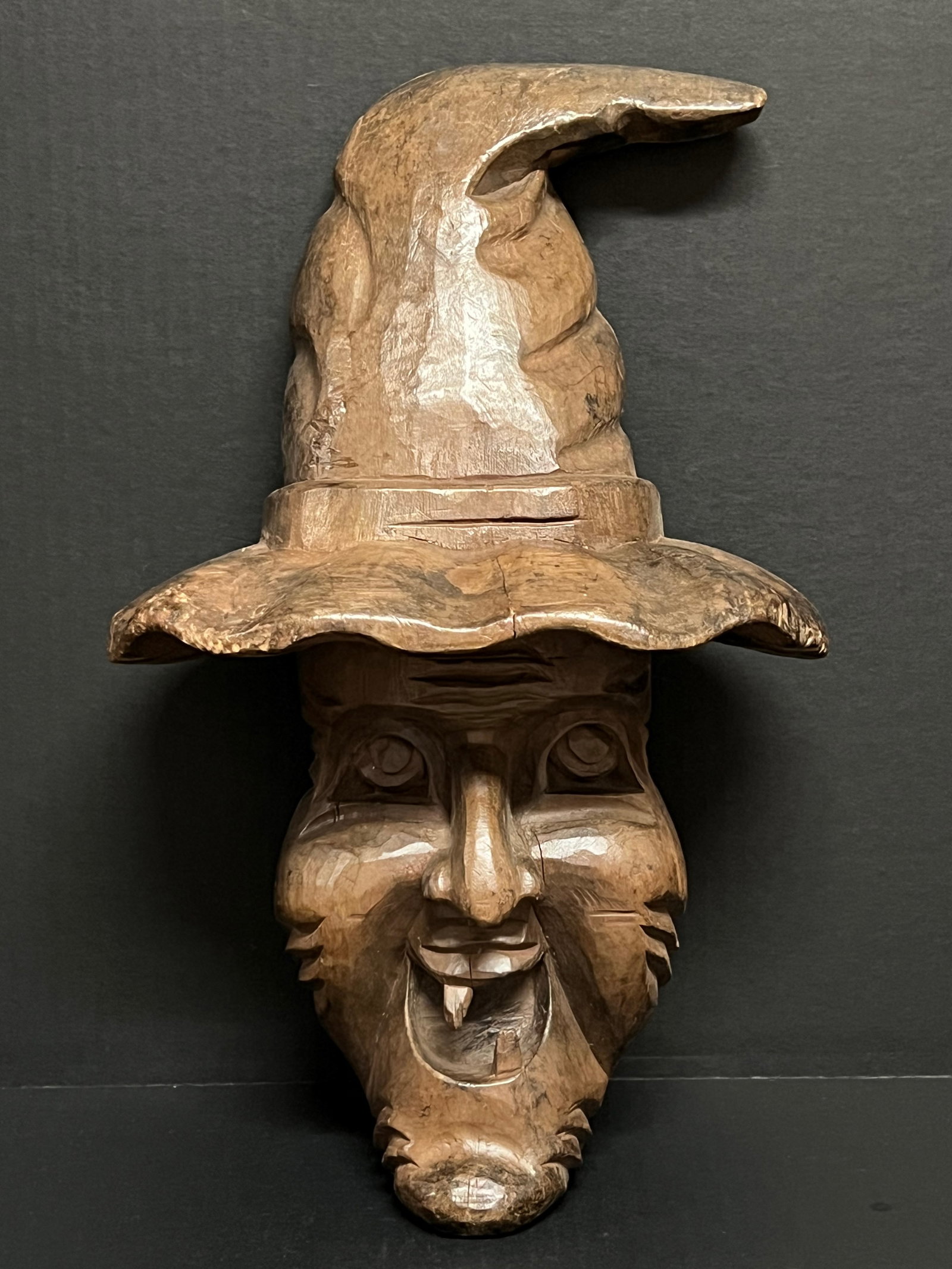 Hand Carved Wooden Wizard Wall Plaque Sculpture: Folk Art Hand Carved Wooden Wizard Wall Plaque Sculpture. The dimension is 14.5 inches high x 9.5 inches wide. Please be aware that some of the items are vintage, secondhand, old ages, antiques and ma