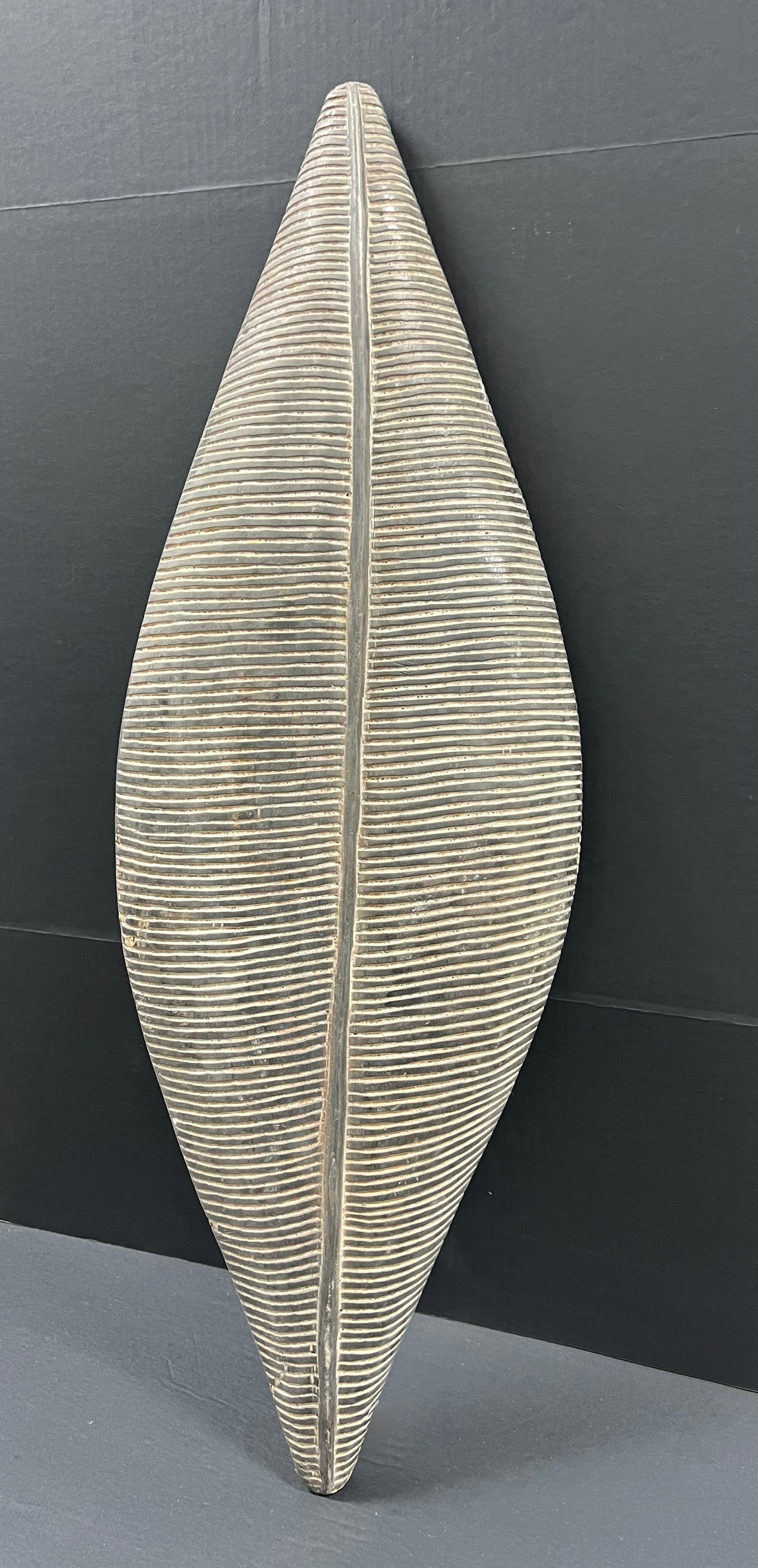 Elongated Zulu Shield: African Tribal Art Elongated Zulu Shield. The dimension is 39 inches high x 13 inches wide. Please be aware that some of the items are vintage, secondhand, old ages, antiques and may have a defects