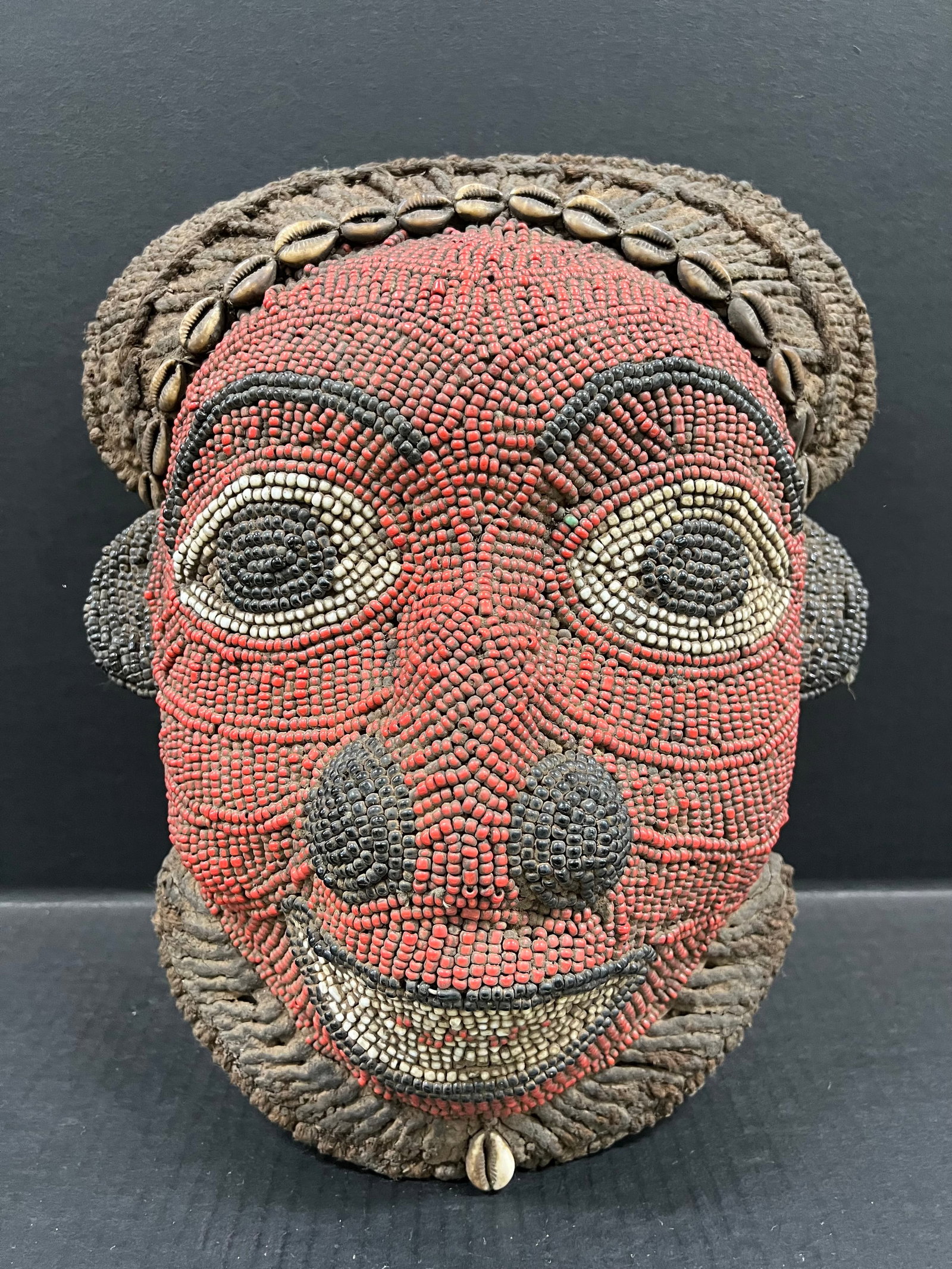 Bamieke Beaded Mask: African Tribal Art Bamileke Beaded Mask. The dimension is 15.5 inches high x 12.5 inches wide. Please be aware that some of the items are vintage, secondhand, old ages, antiques and may have a