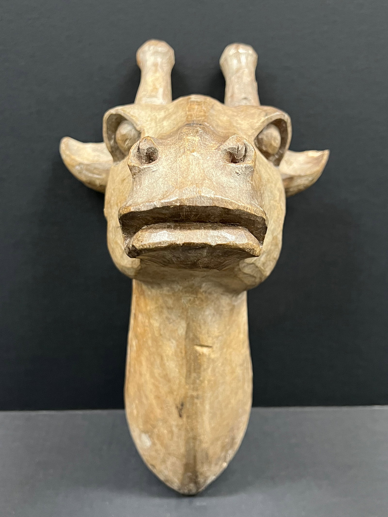 Hand Carved Wooden Giraffe Head Wall Decor culpture: Folk Art Hand Carved Wooden Giraffe Head Wall Decor Sculpture. The dimension is 15.5 inches high x 11 inches wide. Please be aware that some of the items are vintage, secondhand, old ages, antiques an