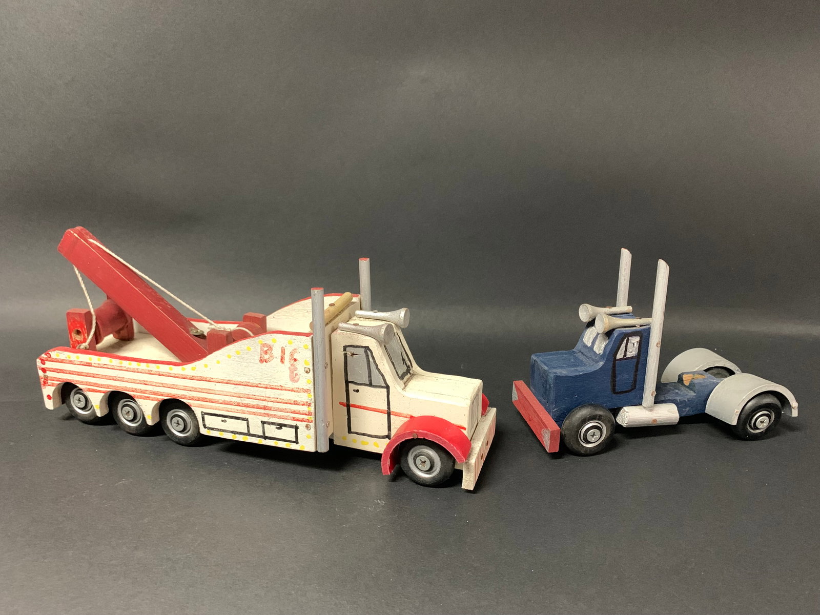 Vintage Carved Wood Painted Trucks Sculpture Lot of 2: Vintage Carved Wood Painted Trucks Sculpture lot of 2. The dimension is 4.75 inches high x 9.5 inches wide. Please be aware that some of the items are vintage, secondhand, old ages, antiques and may h