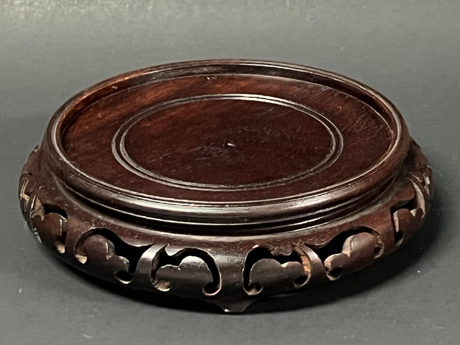 Chinese Art Carved Wooden Display Base: Chinese Art Carved Wooden Display Base. The dimension is 1.25 inches high x 5.25 inches wide. Please be aware that some of the items are vintage, secondhand, old ages, antiques and may have a defects 