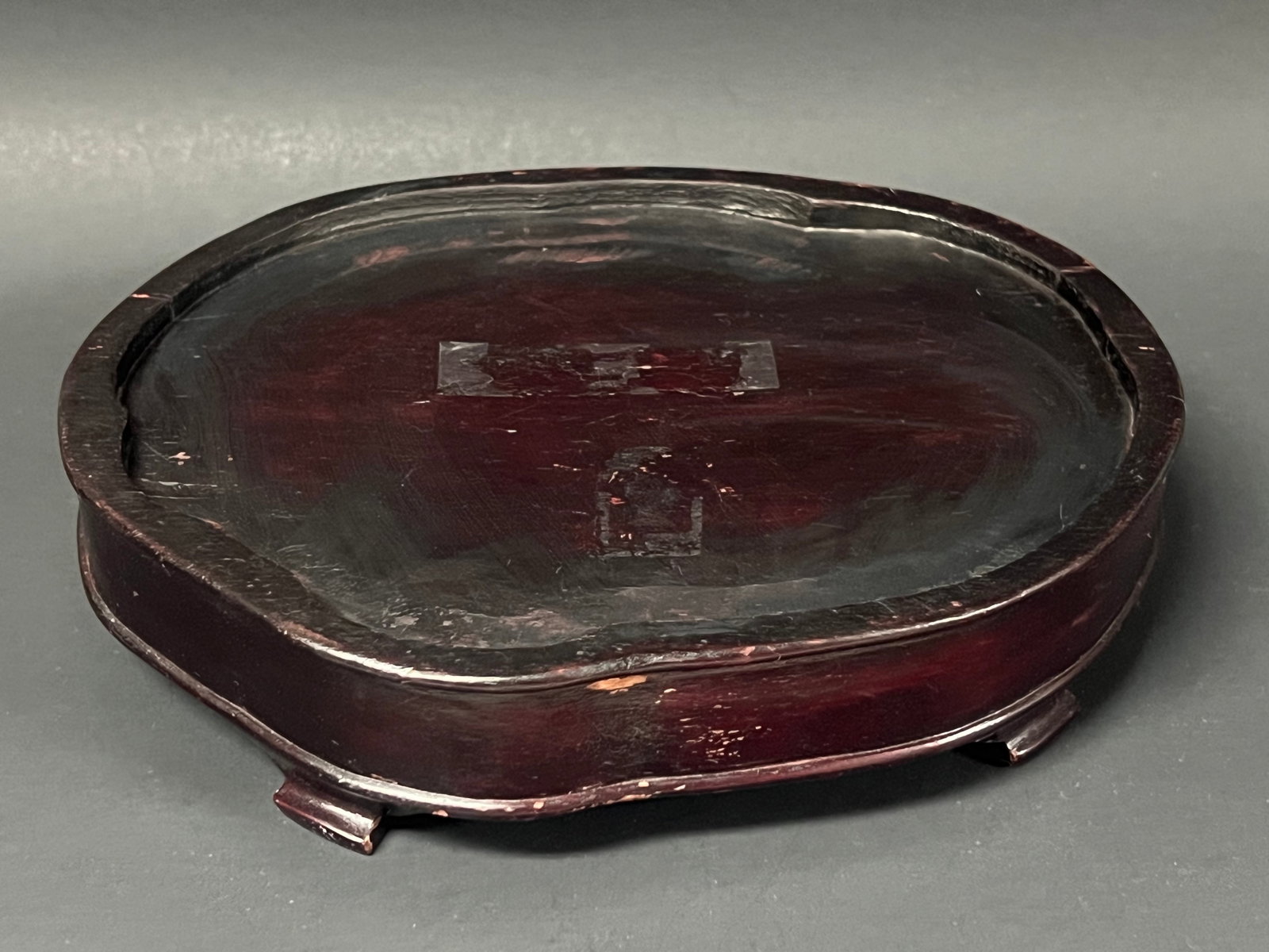 Chinese Art Carved Wooden Display Base: Chinese Art Carved Wooden Display Base. The dimension is 2 inches high x 6.75 inches wide. Please be aware that some of the items are vintage, secondhand, old ages, antiques and may have a defects or