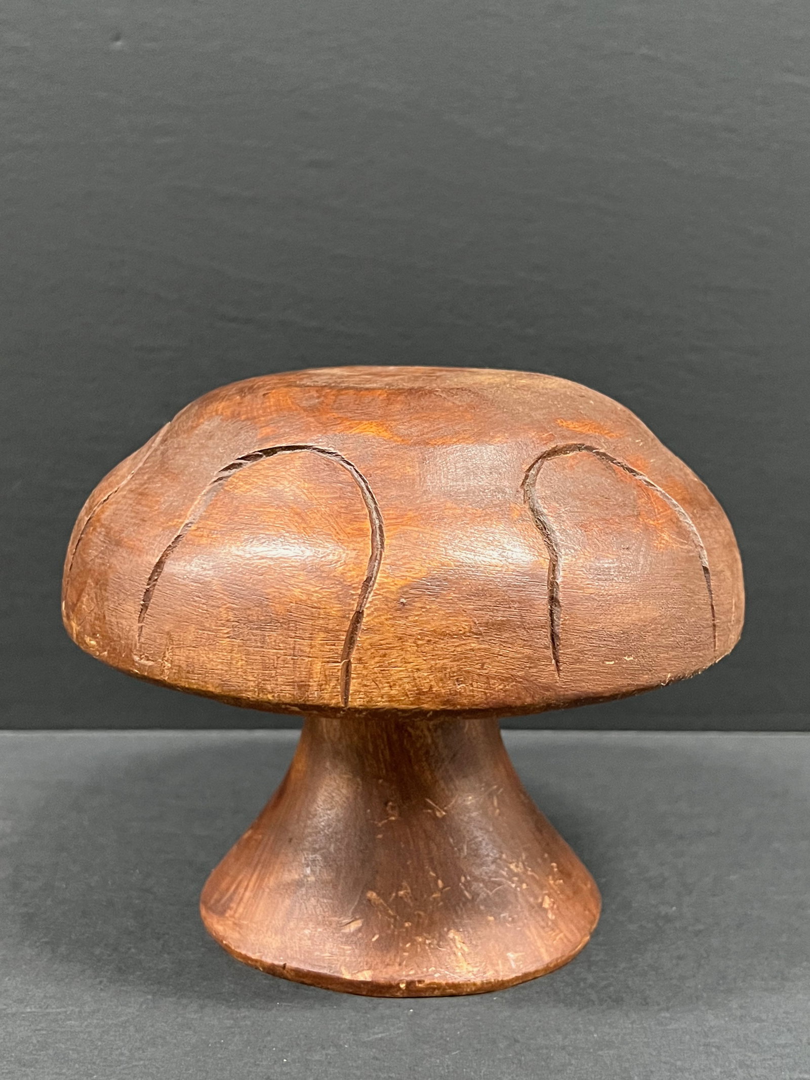 Carved Wood Mushroom Sculpture: Folk Art Carved Wood Mushroom Sculpture. The dimension is 6 inches high x 7 inches wide. Please be aware that some of the items are vintage, secondhand, old ages, antiques and may have a defects or si