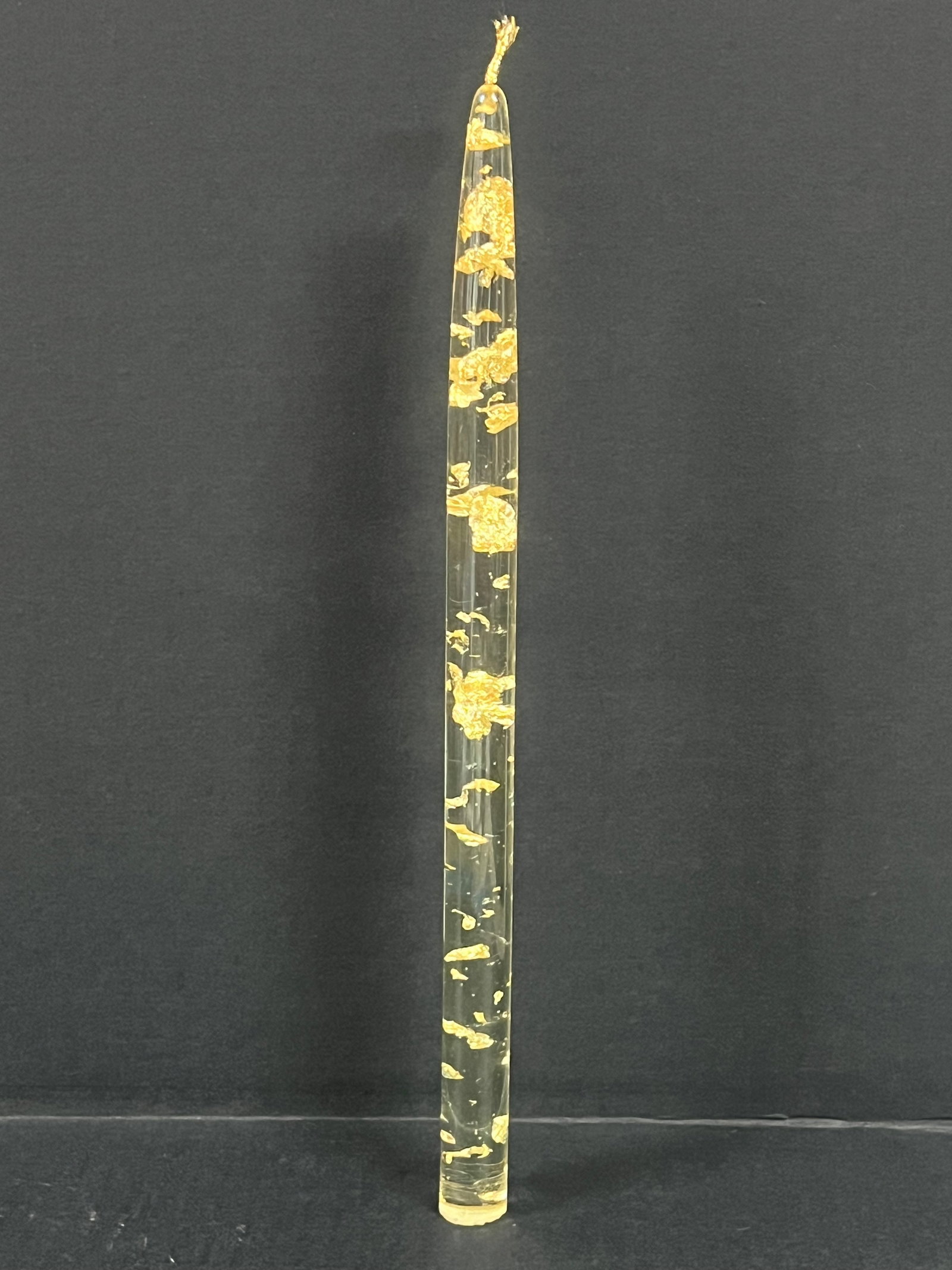Vintage Lucite Candle with Gold Flakes: Vinatge Lucite Candle with Gold Flakes. The dimension is 12 inches high x 1 inches wide. Please be aware that some of the items are vintage, secondhand, old ages, antiques and may have a defects or si