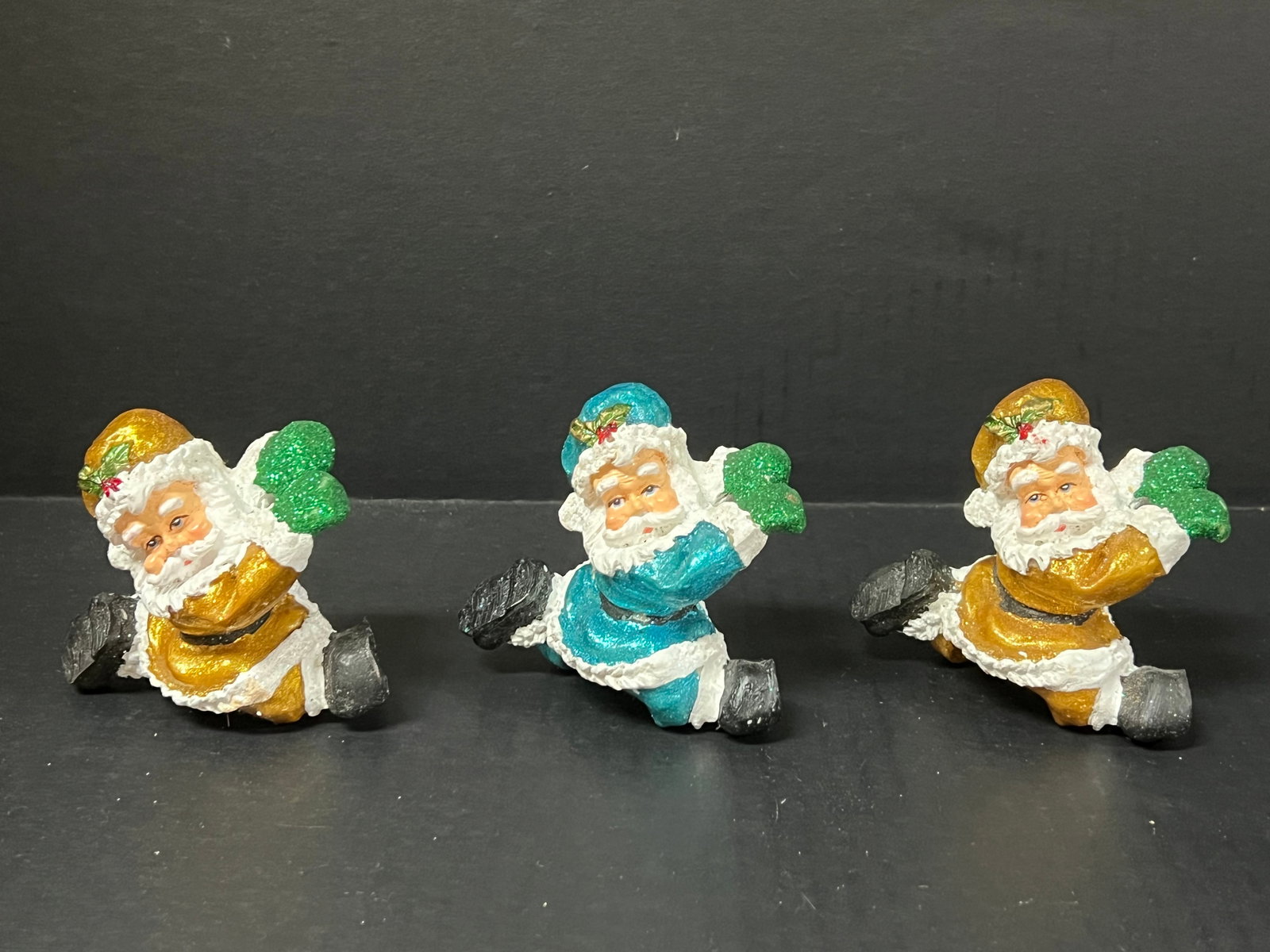 Vintage Cast Resin Santa Claus Sculpture Lot of 3: Vintage Cast Resin Santa Claus Sculpture Lot of 3. The dimension is 3 inches high x 3.75 inches wide. Please be aware that some of the items are vintage, secondhand, old ages, antiques and may have a 