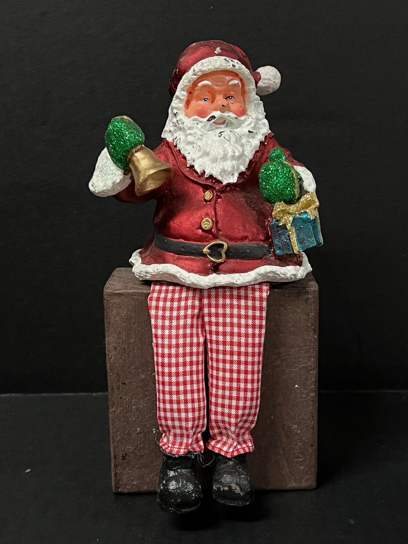 Vintage Cast Resin and Cloth Santa Claus with Bell and Gift Sculpture: Vintage Cast Resin and Cloth Santa Claus with Bell and Gift Sculpture. The dimension is 8.5 inches high x 4 inches wide. Please be aware that some of the items are vintage, secondhand, old ages,