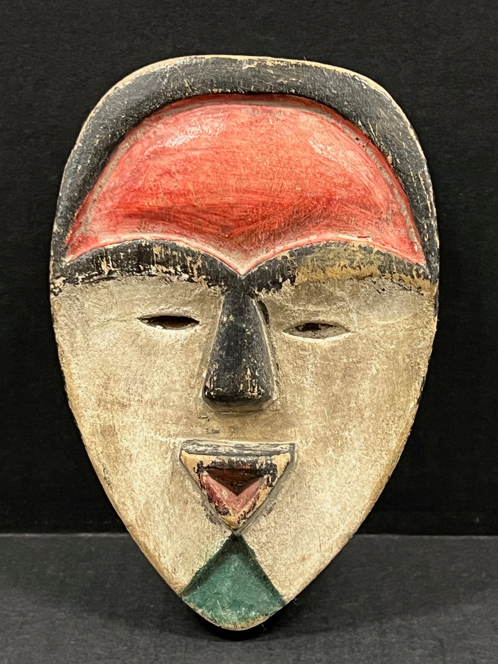 Passport Mask: African Tribal Art Passport Mask. The dimension is 6.25 inches high x 4.25 inches wide. Please be aware that some of the items are vintage, secondhand, old ages, antiques and may have a defects or sig