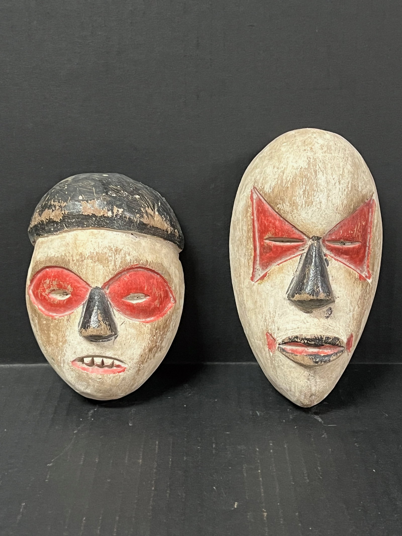 Passport Mask 2 pieces: African Tribal Art Passport Mask. The dimension is 6.5 inches high x 3.75 inches wide and 5.5 inches high x 4 inches wide. Please be aware that some of the items are vintage, secondhand, old ages, ant