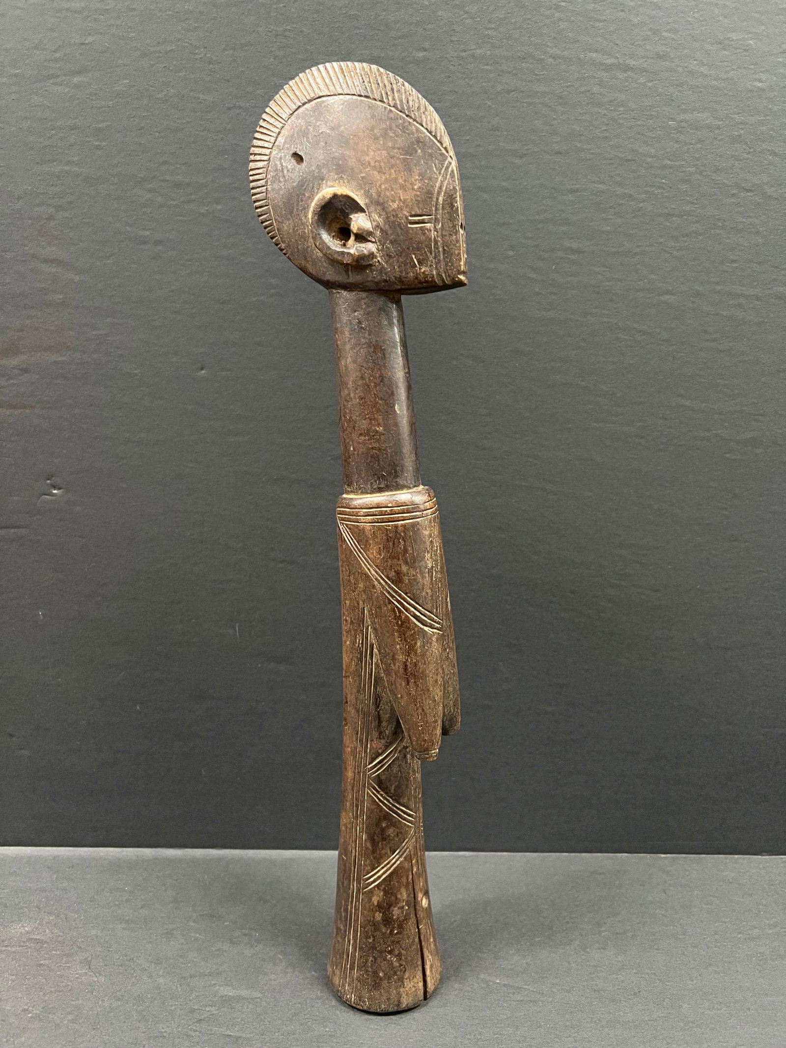 Mossi Fertility Doll: African Tribal Art Mossi Fertility Doll. The dimension is 14.5 inches high x 3 inches wide. Please be aware that some of the items are vintage, secondhand, old ages, antiques and may have a defects
