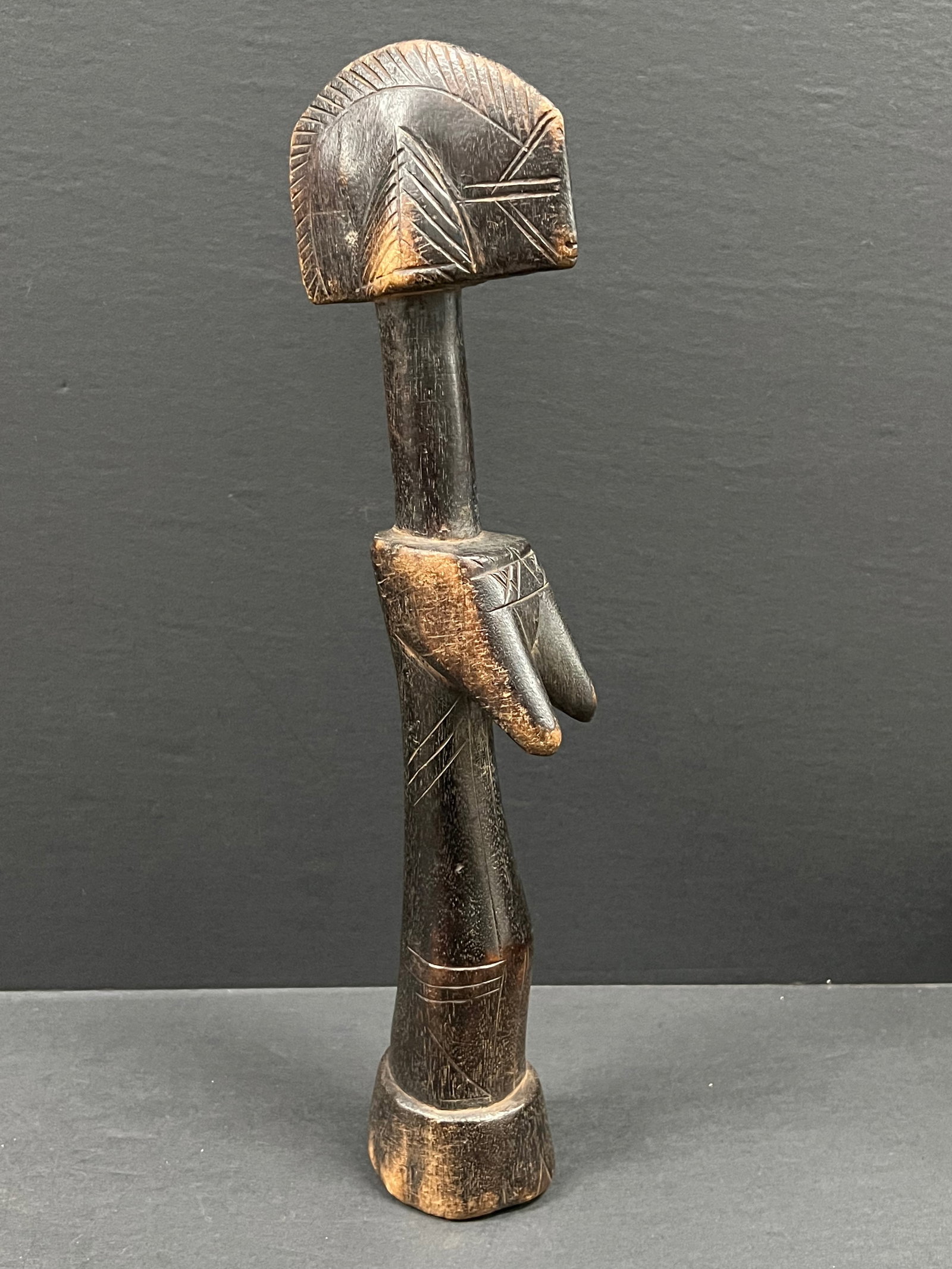 Mossi Fertility Doll: African Tribal Art Mossi Fertility Doll. The dimension is 13.5 inches high x 3.75 inches wide. Please be aware that some of the items are vintage, secondhand, old ages, antiques and may have a