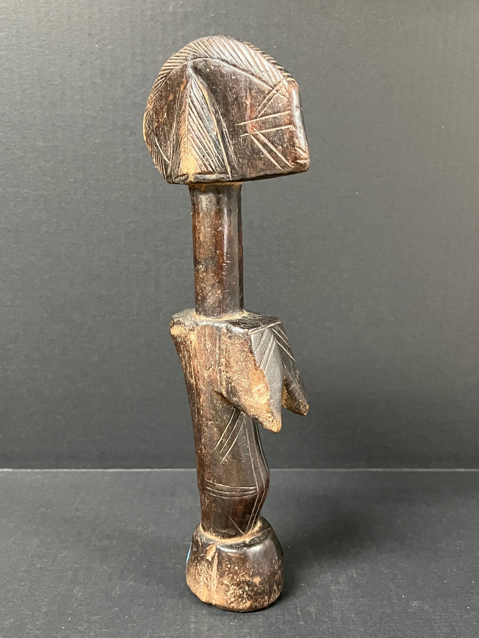 Mossi Fertility Doll: African Tribal Art Mossi Fertility Doll. The dimension is 13 inches high x 4.5 inches wide. Please be aware that some of the items are vintage, secondhand, old ages, antiques and may have a defects