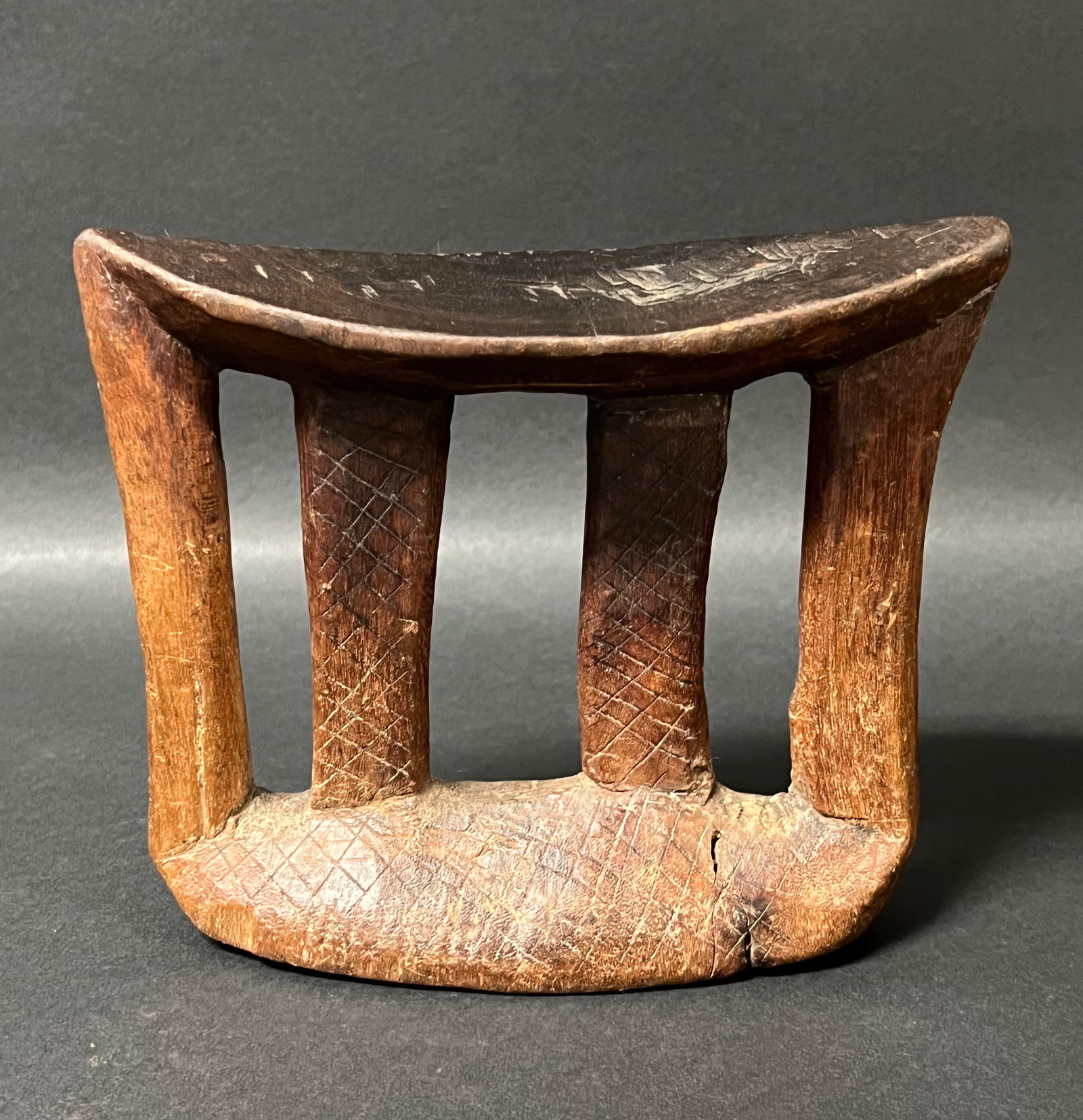 Ethiopian Headrest Pillow: African Tribal Art Ethiopian Headrest Pillow. The dimension is 5.5 inches high x 7 inches wide. Please be aware that some of the items are vintage, secondhand, old ages, antiques and may have a