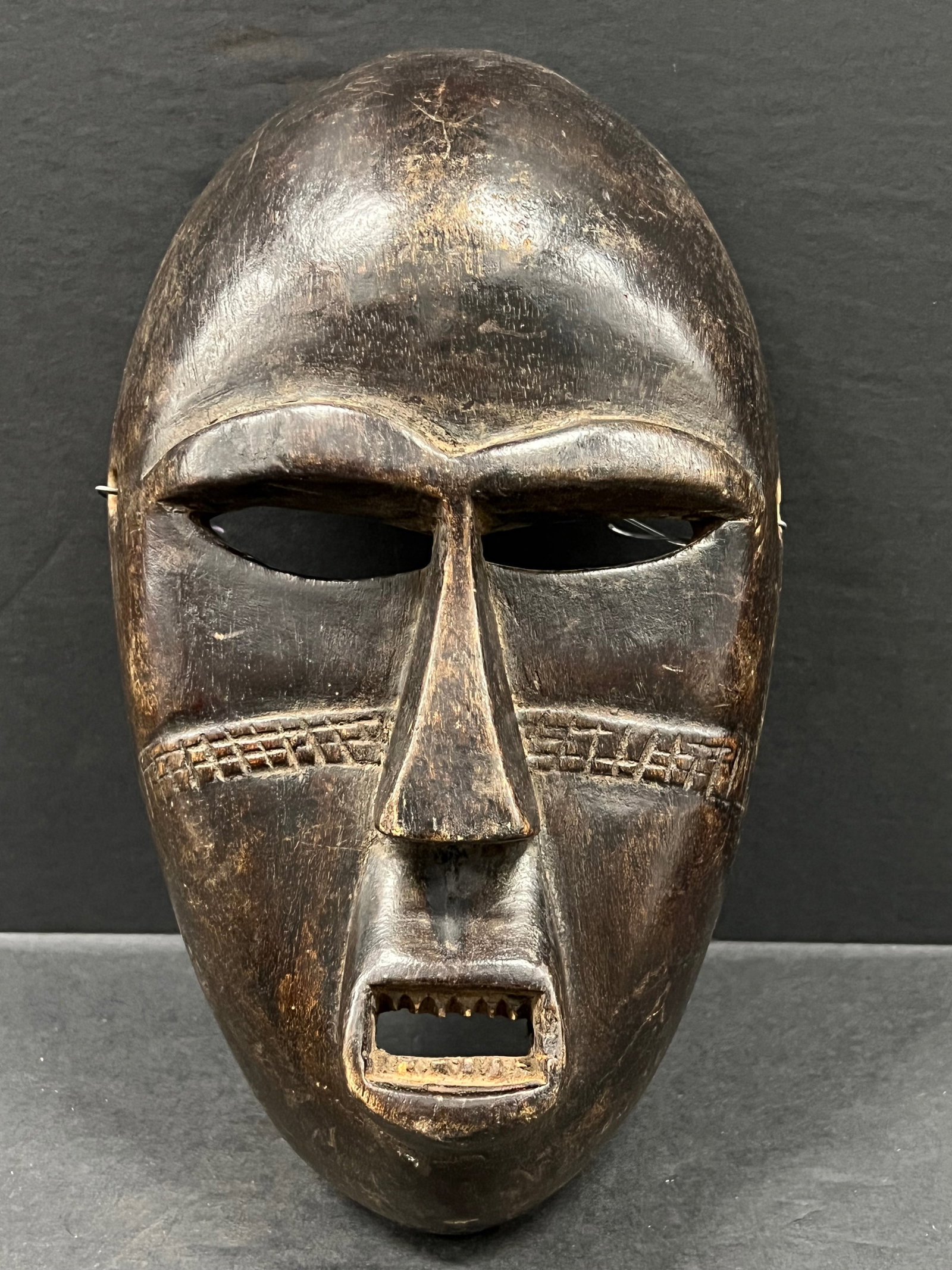 Bamana Mask: African Tribal Art Bamana Mask. The dimension is 11 inches high x 6.5 inches wide. Please be aware that some of the items are vintage, secondhand, old ages, antiques and may have a defects or sign of 