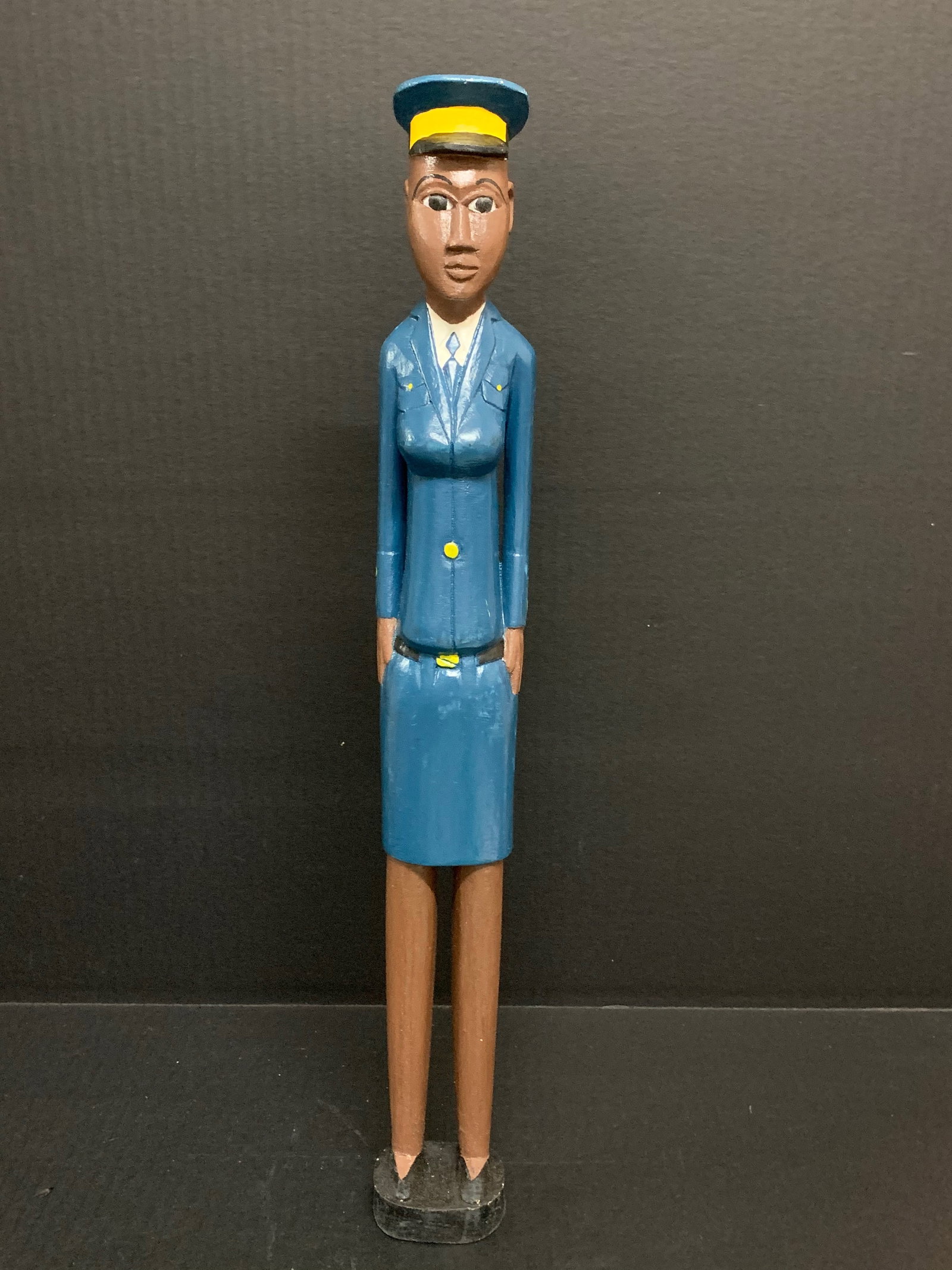 Colonial Statue: African Tribal Art Colonial Statue. The dimension is 18.75 inches high x 2.5 inches wide. Please be aware that some of the items are vintage, secondhand, old ages, antiques and may have a defects or
