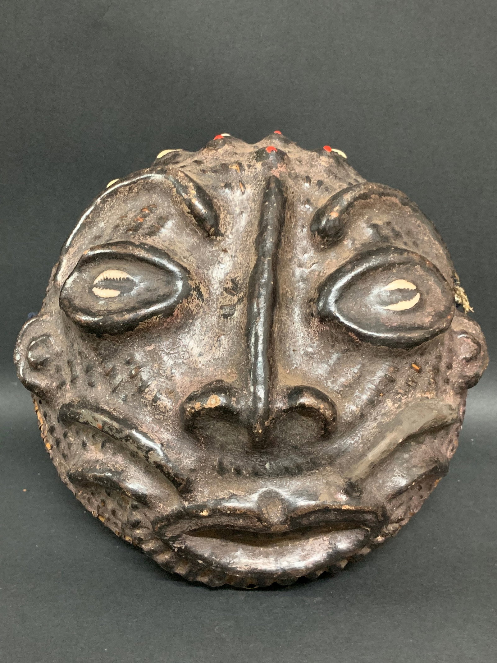 Bamileke Headdress: African Tribal Art Bamileke Headdress. The dimension is 3 inches high x 8 inches wide. Please be aware that some of the items are vintage, secondhand, old ages, antiques and may have a defects or sign