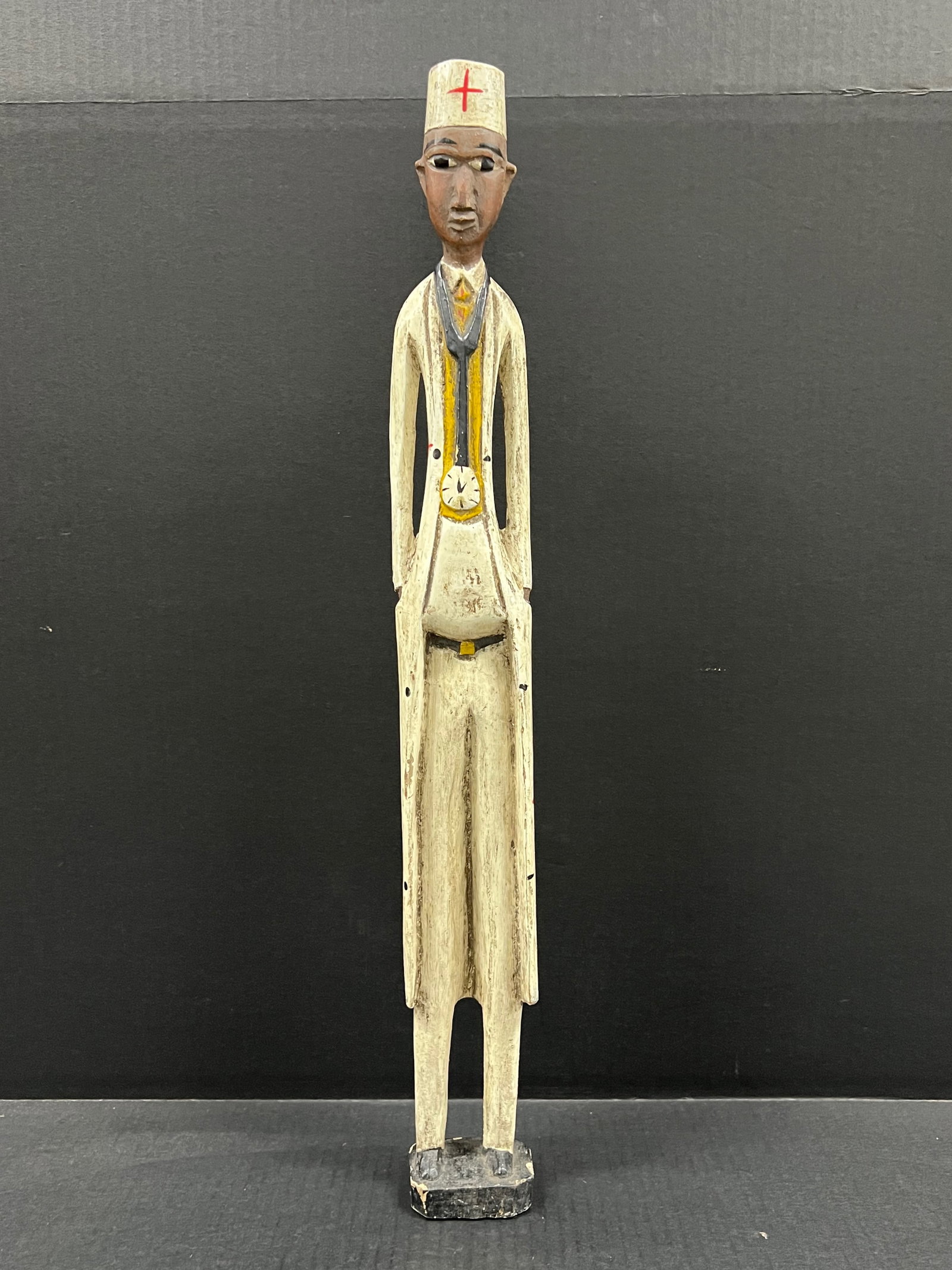 Colonial Statue: African Tribal Art Colonial Statue. The dimension is 23.75 inches high x 2.75 inches wide. Please be aware that some of the items are vintage, secondhand, old ages, antiques and may have a defects or 