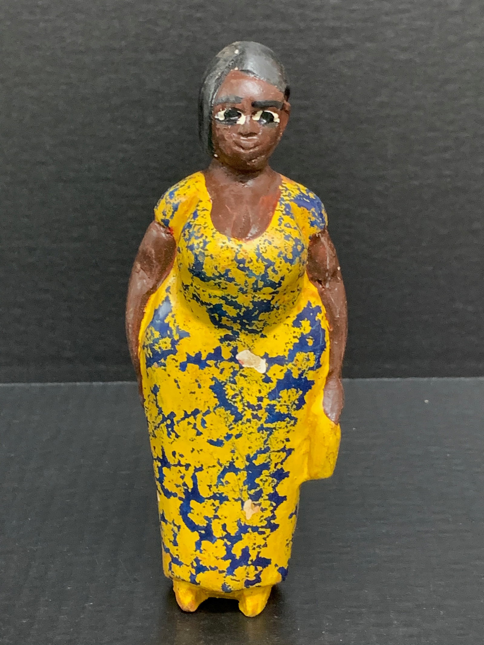 Colonial Statue: African Tribal Art Colonial Statue. The dimension is 7.25 inches high x 2.25 inches wide. Please be aware that some of the items are vintage, secondhand, old ages, antiques and may have a defects or s