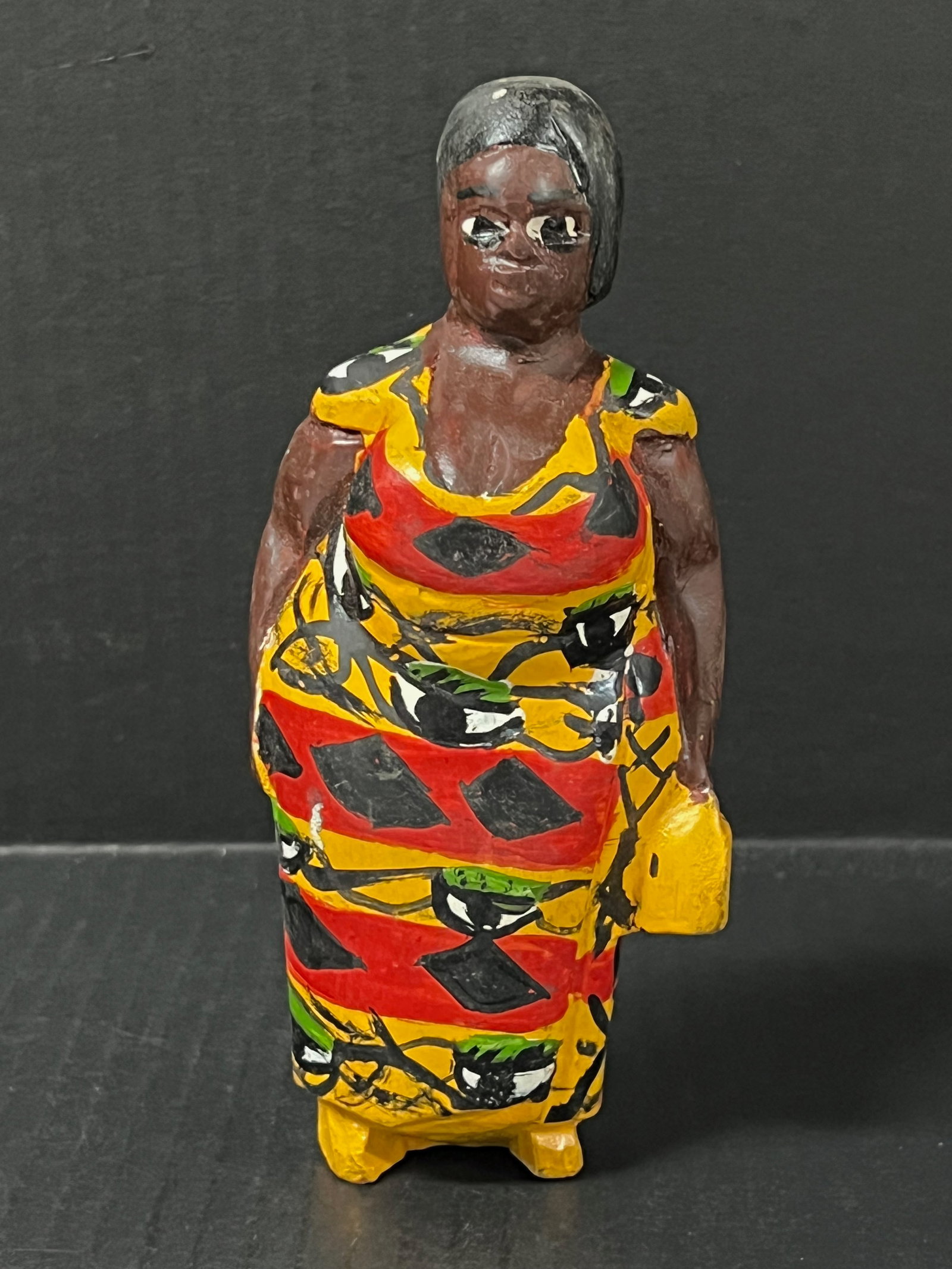 Colonial Statue: African Tribal Art Colonial Statue. The dimension is 7 inches high x 3 inches wide. Please be aware that some of the items are vintage, secondhand, old ages, antiques and may have a defects or sign