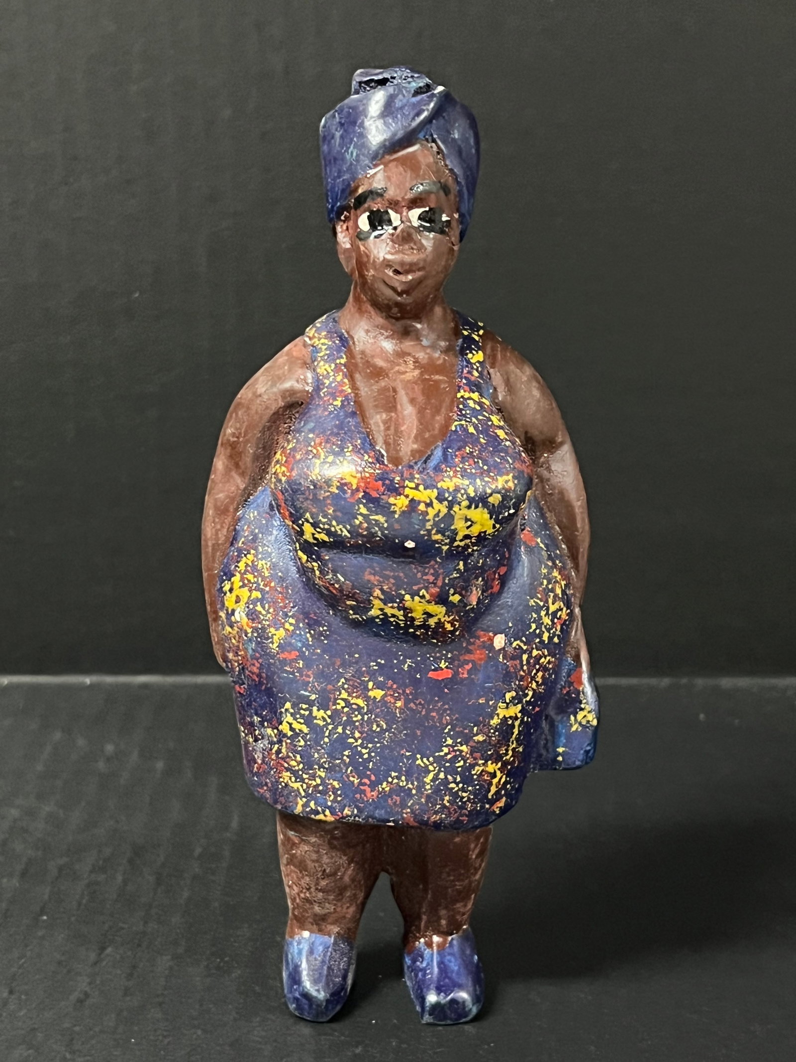 Colonial Statue: African Tribal Art Colonial Statue. The dimension is 7.25 inches high x 3 inches wide. Please be aware that some of the items are vintage, secondhand, old ages, antiques and may have a defects or sign