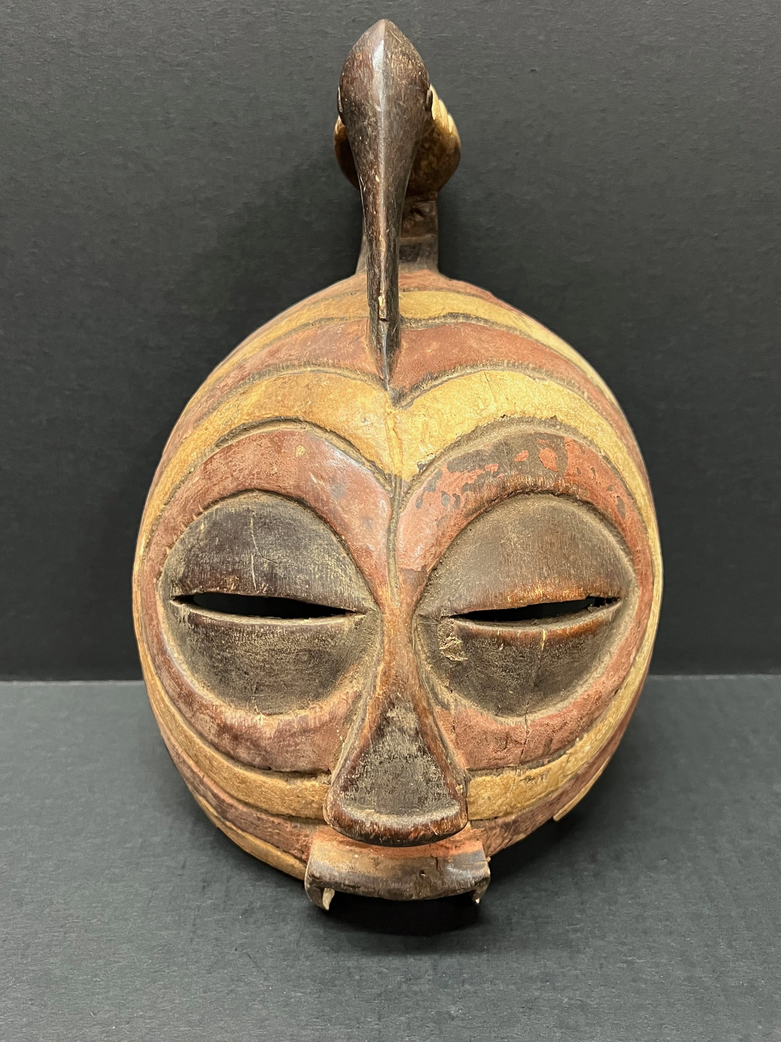 Basonge Mask: African Tribal Art Basonge Mask. The dimension is 10 inches high x 7 inches wide. Please be aware that some of the items are vintage, secondhand, old ages, antiques and may have a defects or sign of a