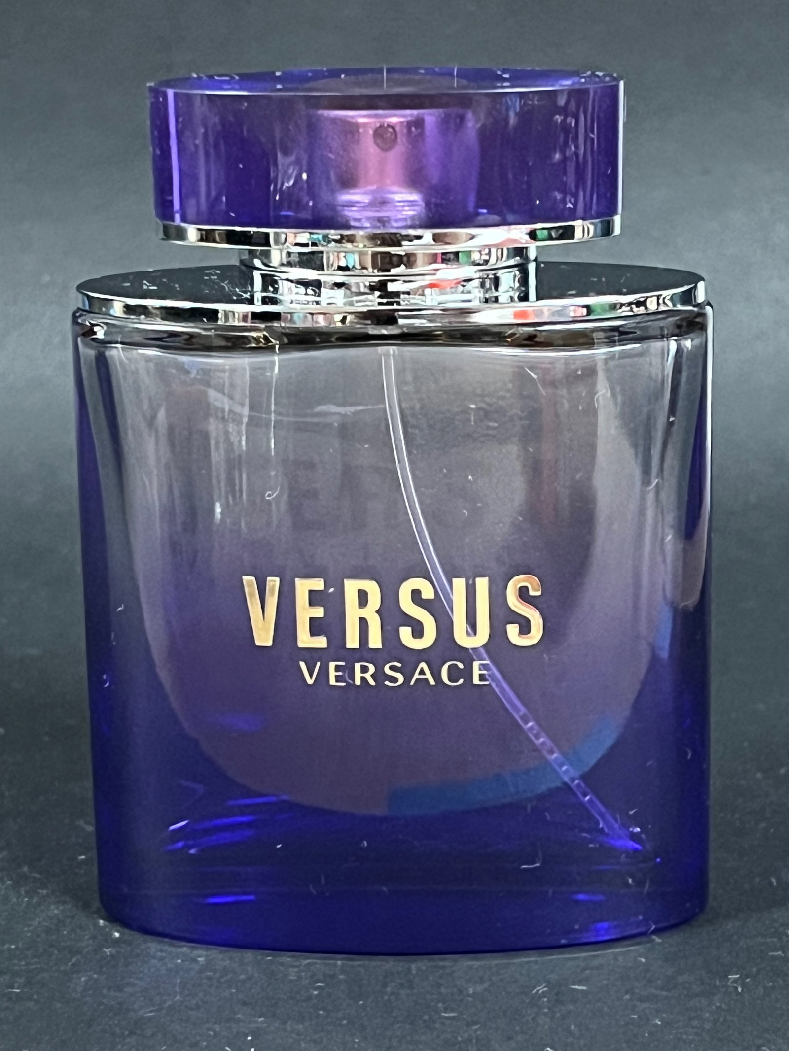 Empty Bottle Only -Versace Versus Purple Glass Eau De Toilette Bottle: Empty Bottle Only - Versace Versus Purple Glass Eau De Toilette Bottle. The dimension is 4.5 inches high x 3.25 inches wide. Please be aware that some of the items are vintage, secondhand, old ages,