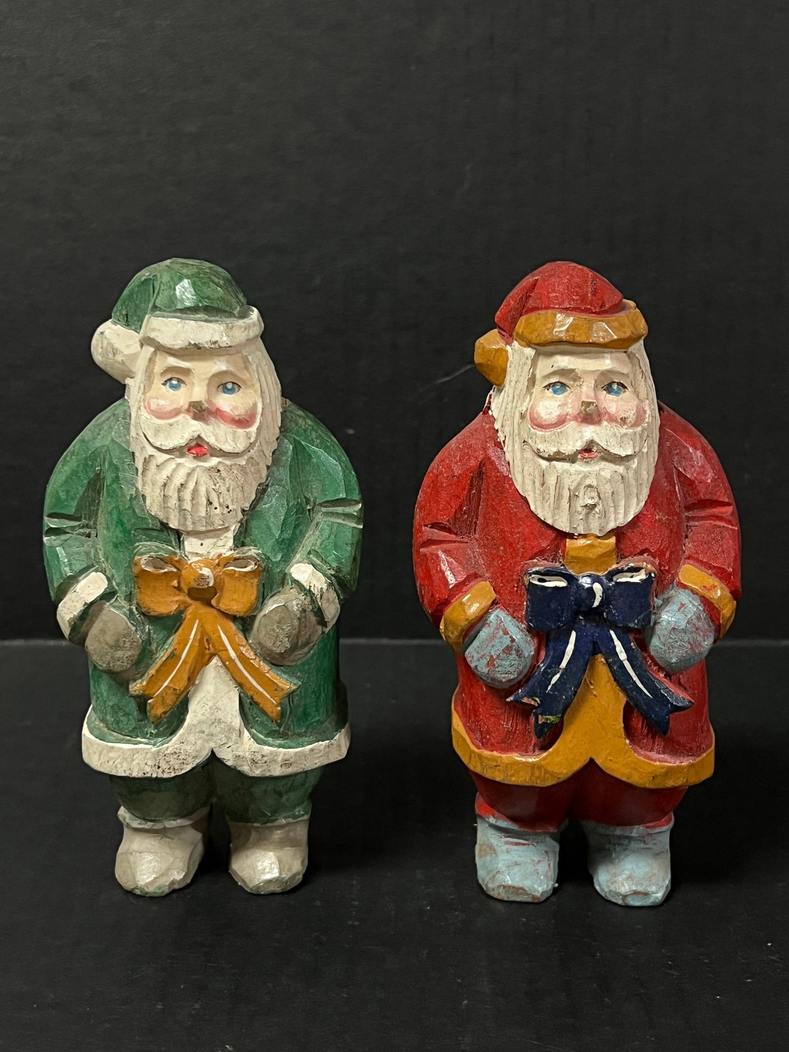 Carved Wood Santa Claus 2 pieces: Folk Art Carved Wood Santa Claus. The dimension is 6 inches high x 3 inches wide. Please be aware that some of the items are vintage, secondhand, old ages, antiques and may have a defects or sign of
