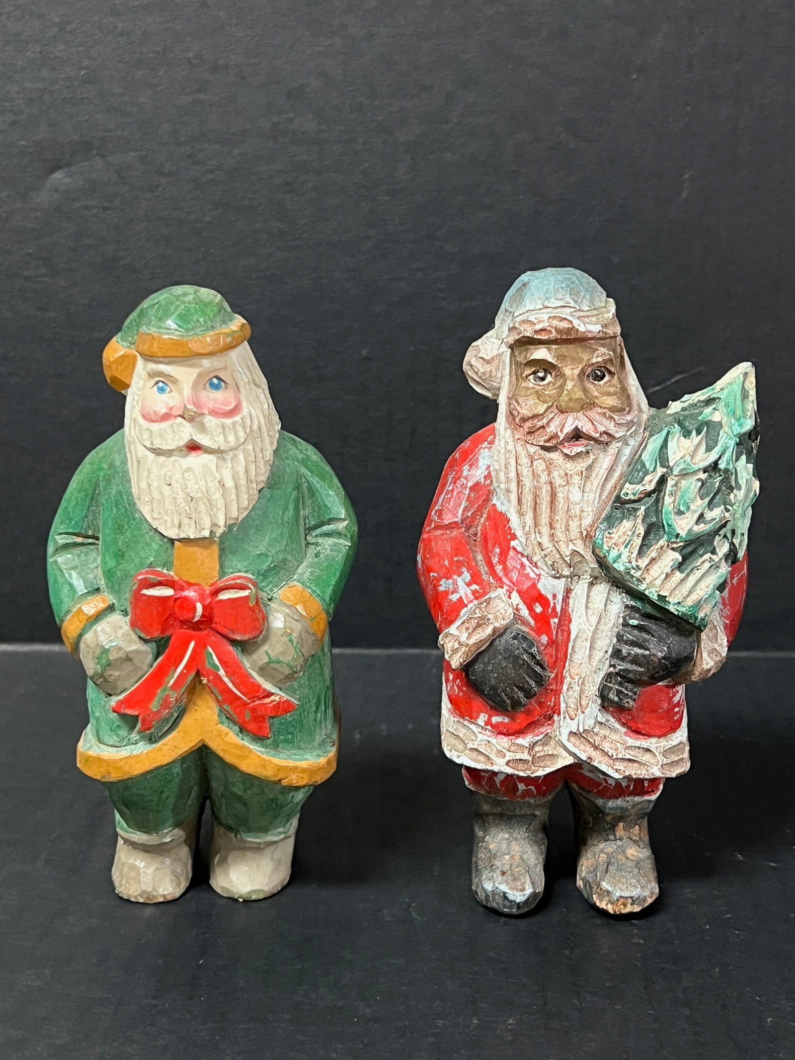 Carved Wood Santa Claus 2 pieces: Folk Art Carved Wood Santa Claus. The dimension is 6 inches high x 3 inches wide. Please be aware that some of the items are vintage, secondhand, old ages, antiques and may have a defects or sign of