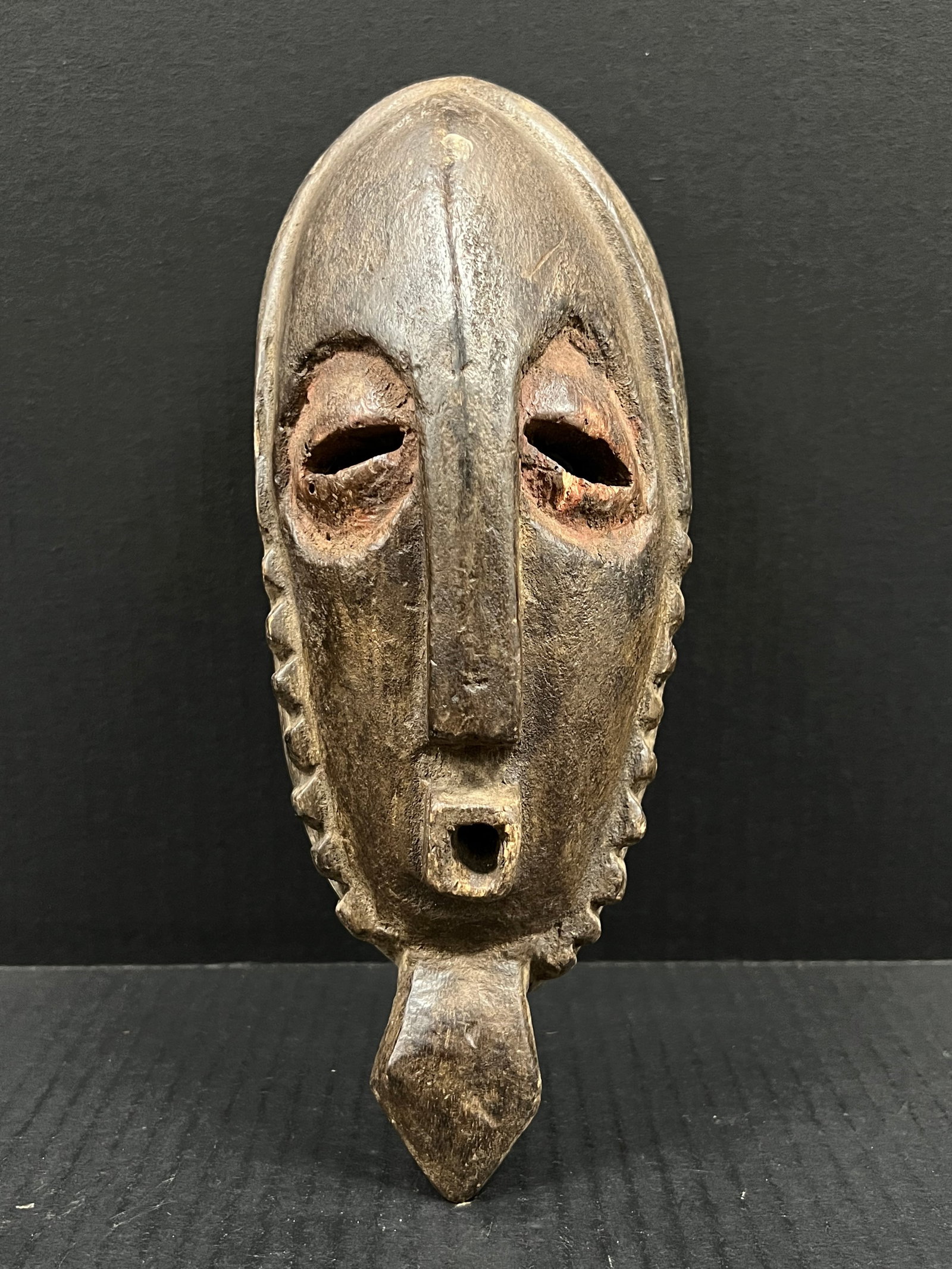 Chokwe Mask: African Tribal Art Chokwe Mask. The dimension is 11 inches high x 4.5 inches wide. Please be aware that some of the items are vintage, secondhand, old ages, antiques and may have a defects or sign of