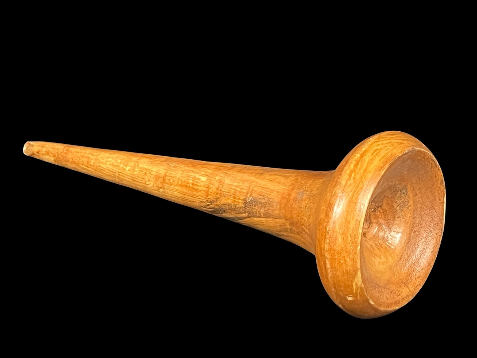 Folk Art Carved Wood Trumpet: Folk Art Carved Wood Trumpet. The dimension is 8.75 inches high x 3 inches wide. Please be aware that some of the items are vintage, secondhand, old ages, antiques and may have a defects or sign of