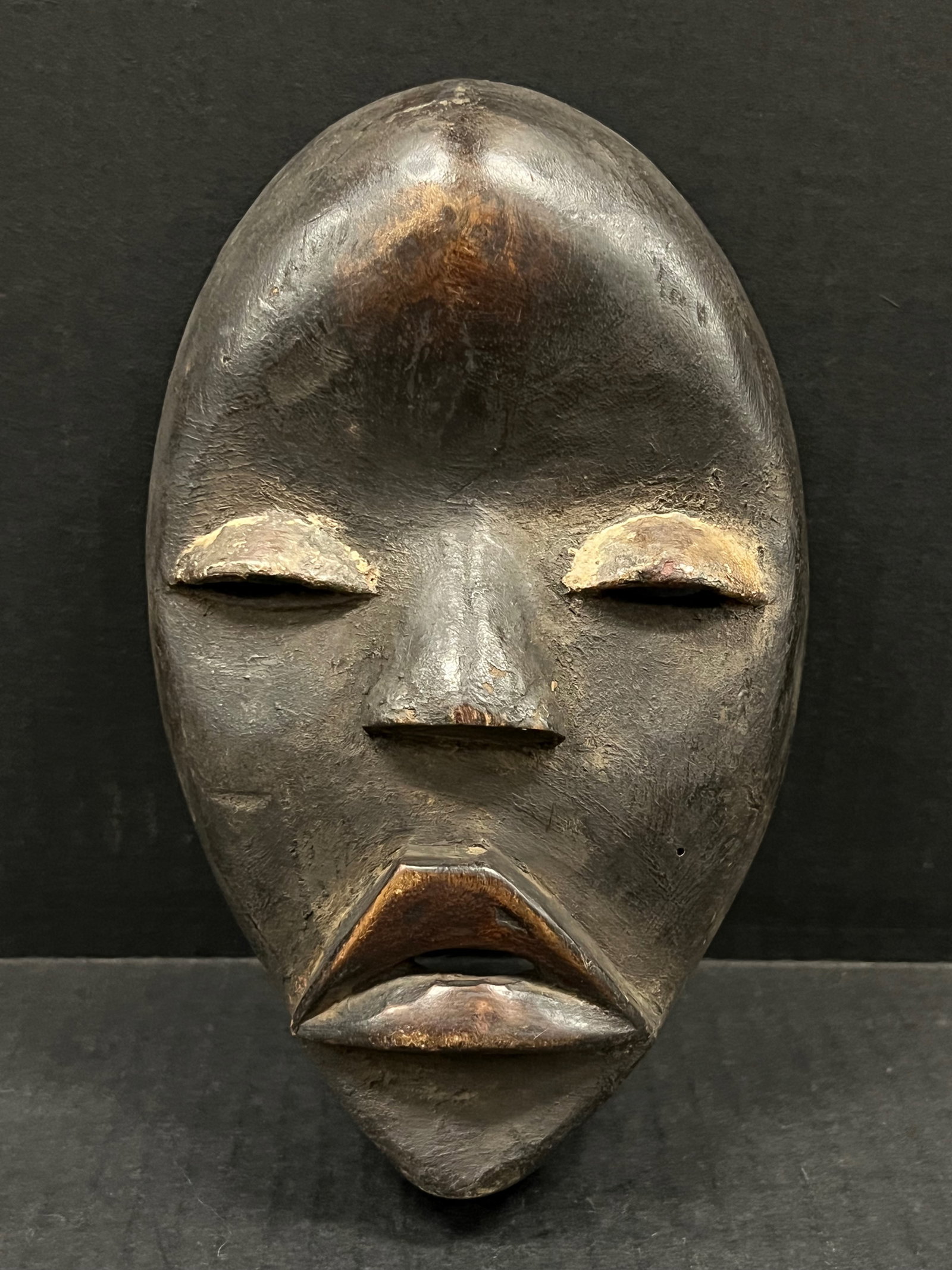 Dan Mask: African Tribal Art Dan Mask. The dimension is 8 inches high x 5 inches wide. Please be aware that some of the items are vintage, secondhand, old ages, antiques and may have a defects or sign of ages,