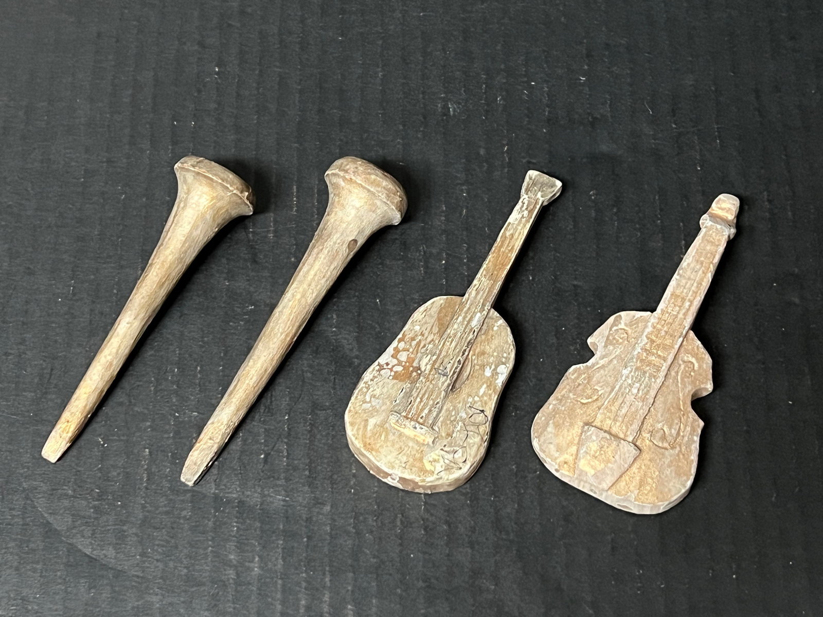 Set of 4 Vintage Carved Wood Miniature Guitar and Trumpet Sculpture: Set of 4 Vintage Carved Wood Miniature Guitar and Trumpet Sculpture. The dimension is 5.5 inches high x 2 inches wide. Please be aware that some of the items are vintage, secondhand, old ages, antique