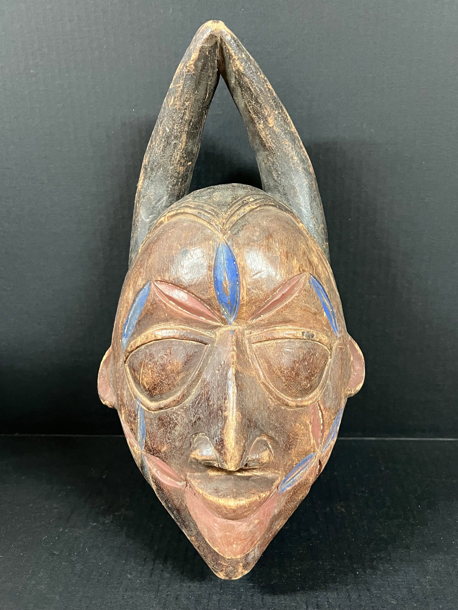 Yoruba Mask: African Tribal Art Yoruba Mask. The dimension is 16 inches high x 9.5 inches wide. Please be aware that some of the items are vintage, secondhand, old ages, antiques and may have a defects or sign of