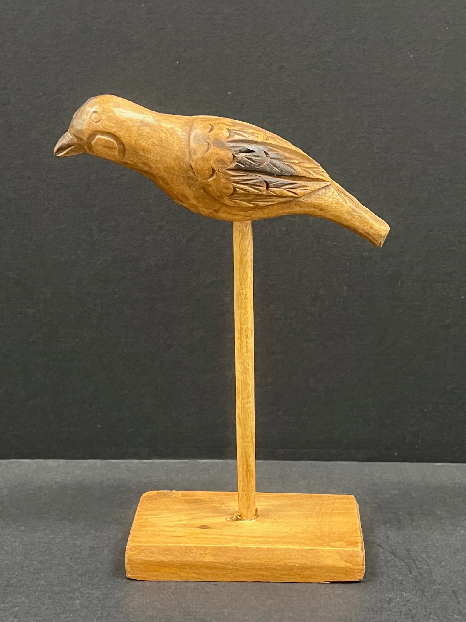 Carved Wood Bird Sculpture: Vintage Carved Wood Bird Sculpture. The dimension is 9.5 inches high x 7 inches wide. Please be aware that some of the items are vintage, secondhand, old ages, antiques and may have a defects or sign