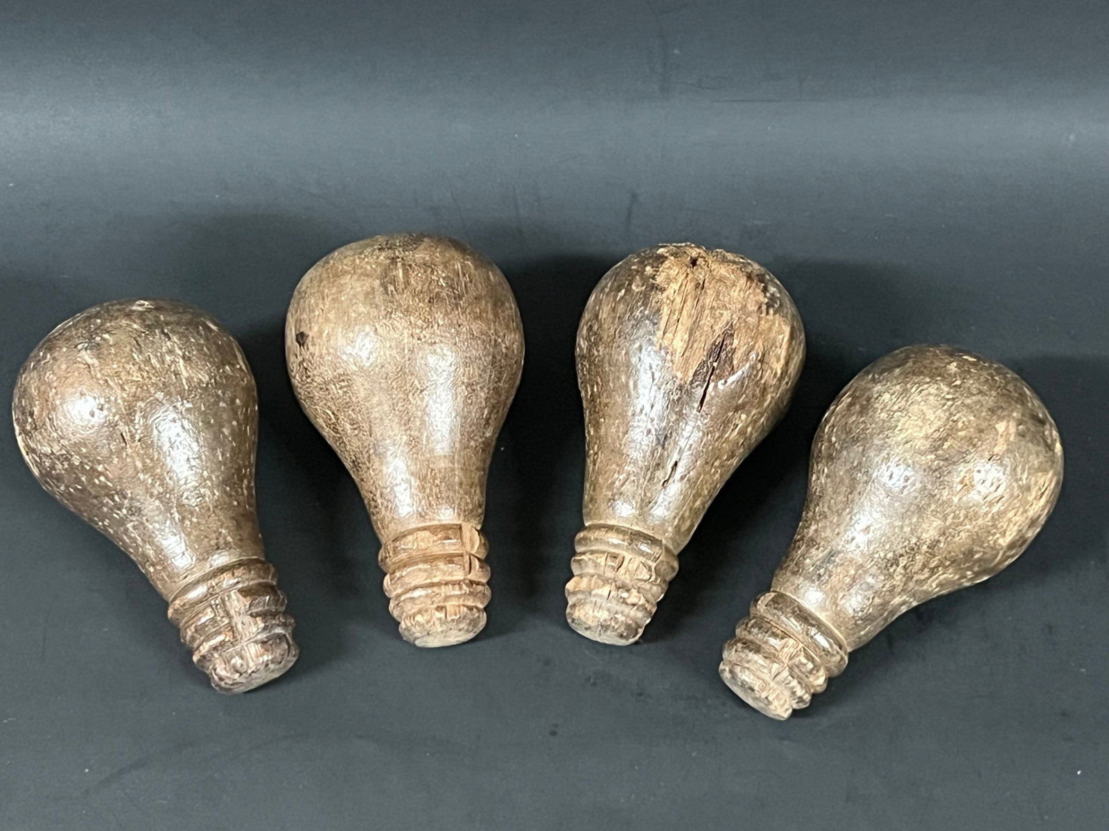 Vintage Carved Wood Bulb Sculpture Lot of 4: Vintage Carved Wood Bulb Sculpture Lot of 4. The dimension is 4 inches high x 2 inches wide. Please be aware that some of the items are vintage, secondhand, old ages, antiques and may have a defects o
