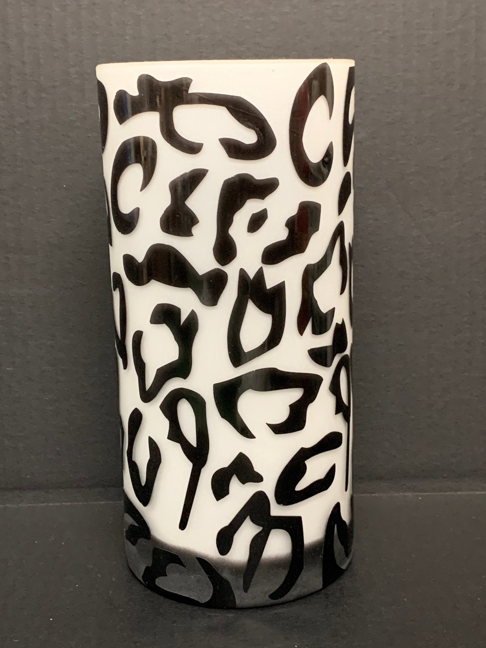 Black And White Frosted Art Glass Vase: Black and White Frosted Art Vase. The dimension is 12 inches high x 6 inches wide. Please be aware that some of the items are vintage, secondhand, old ages, antiques and may have a defects or sign of 